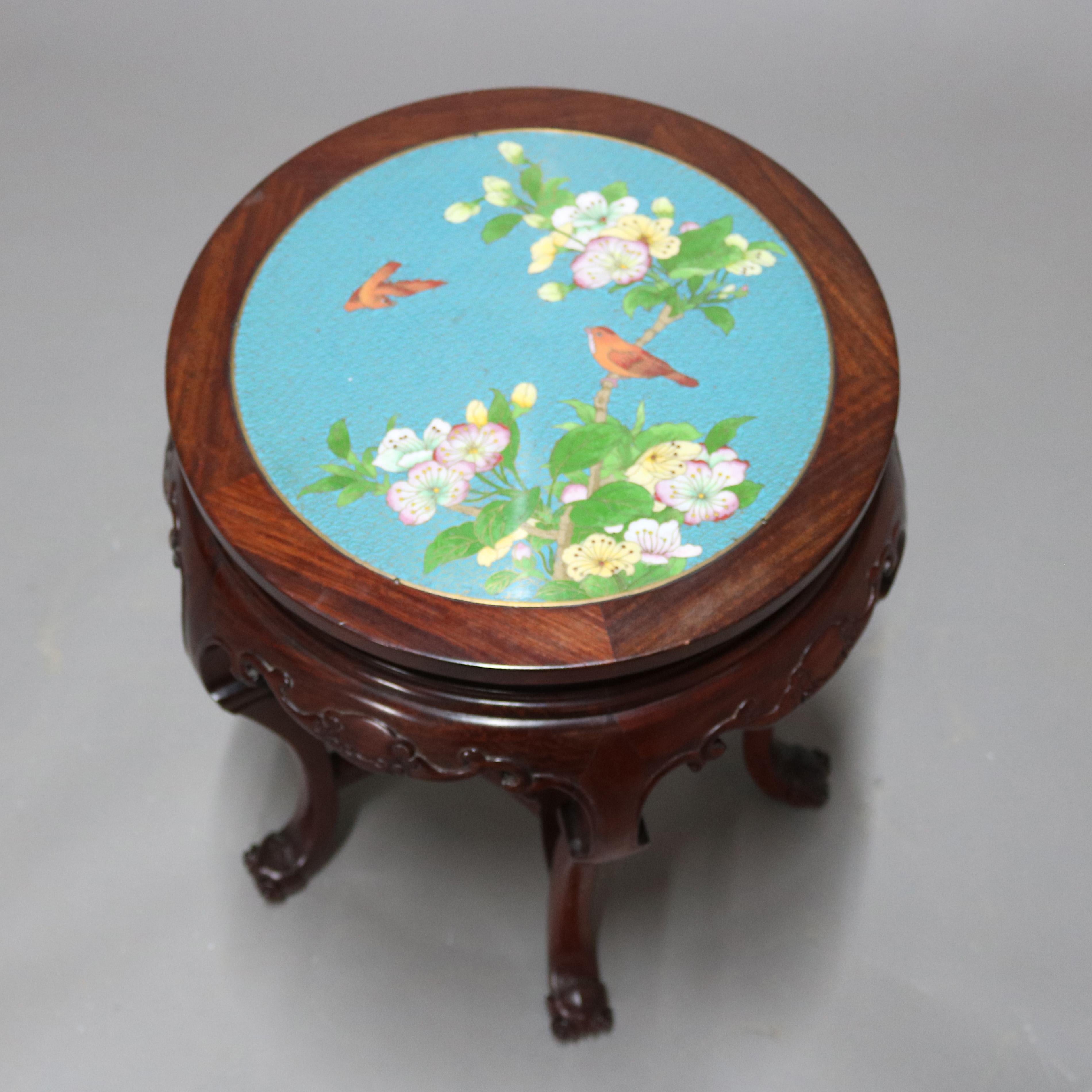 A vintage Chinese low table offers Cloisonné inset top having garden scene motif seated in carved mahogany base with shaped skirt raised on cabriole legs, 20th century

Measures: 20.25