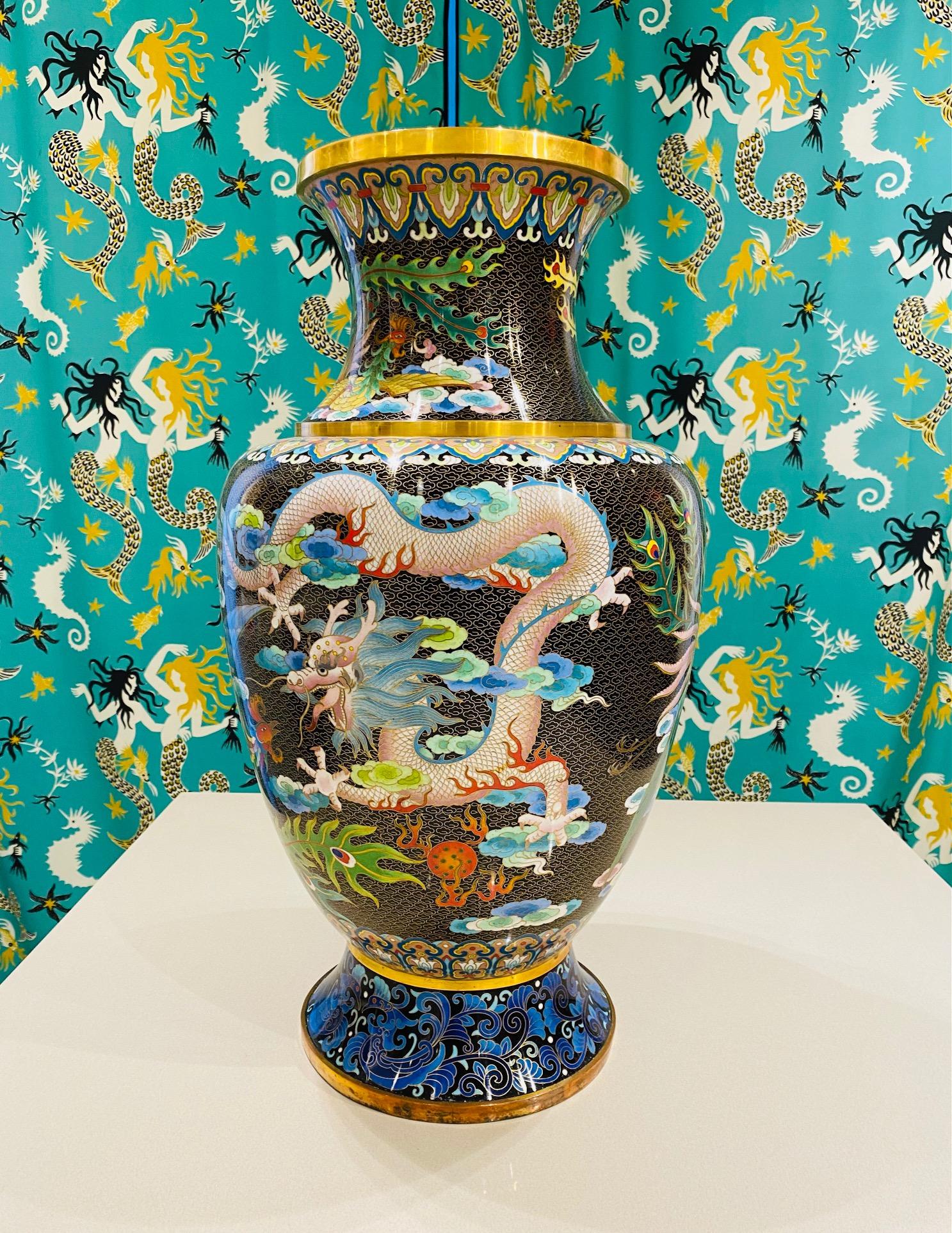 1940's Chinese Cloisonné large vase. Cloisonné is an ancient technique which incorporates decorative materials like enamel, colored glass, or gemstones into metalwork objects bound by wire on metal backing. The vase features extraordinary depictions