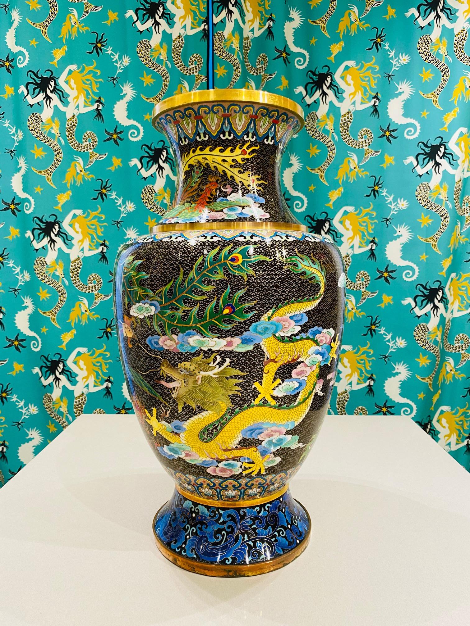 1940s Chinese Cloisonné large vase. Cloisonné is an ancient technique which incorporates decorative materials like enamel, colored glass, or gemstones into metalwork objects bound by wire on metal backing. The vase features extraordinary depictions