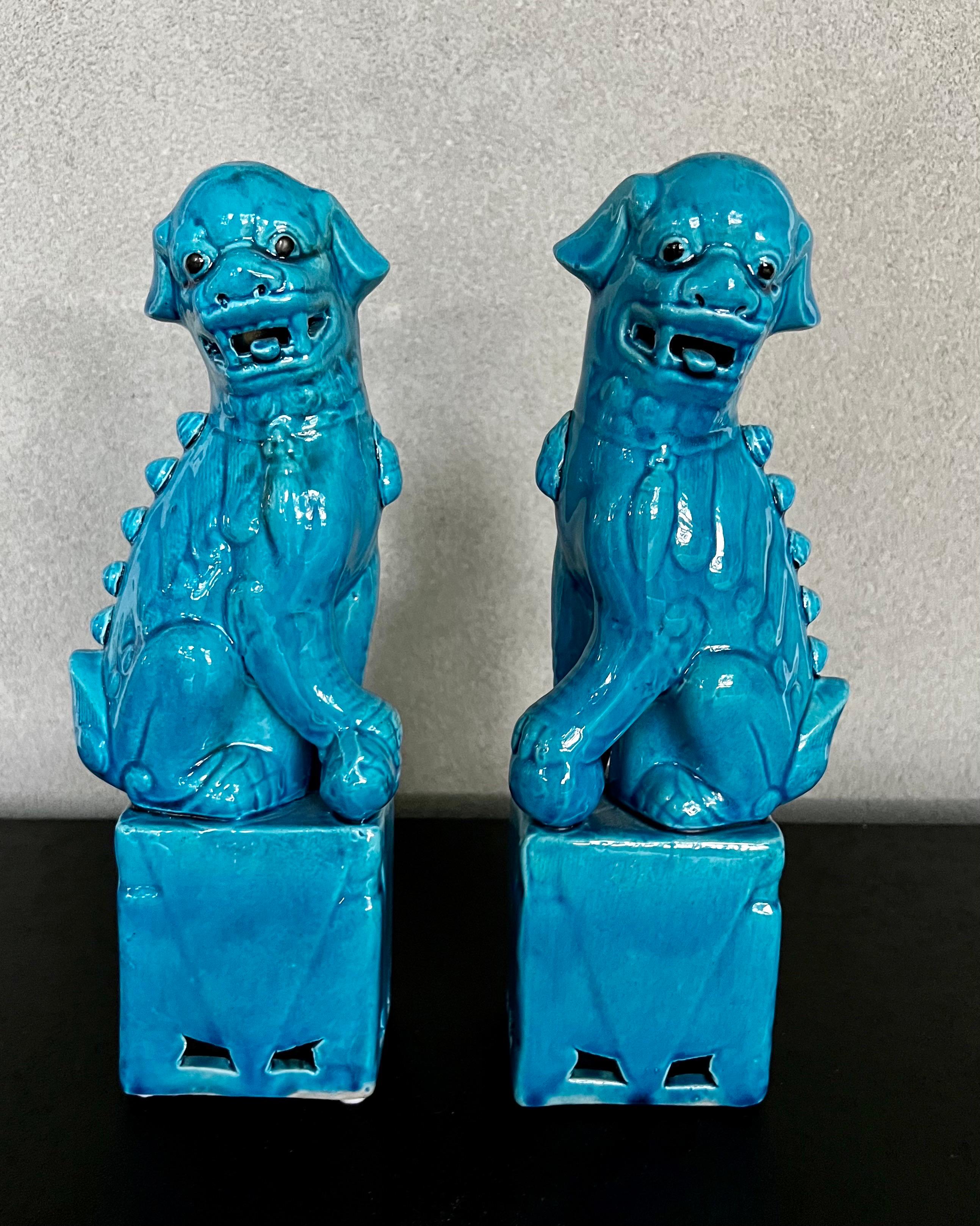 Beautiful Cobalt Blue Large Vintage Glazed Ceramic Foo Dogs,Female and Male 
Striking color dogs  to have as decor in a bookcase or coffee table and add  Chinoiserie style to your decor