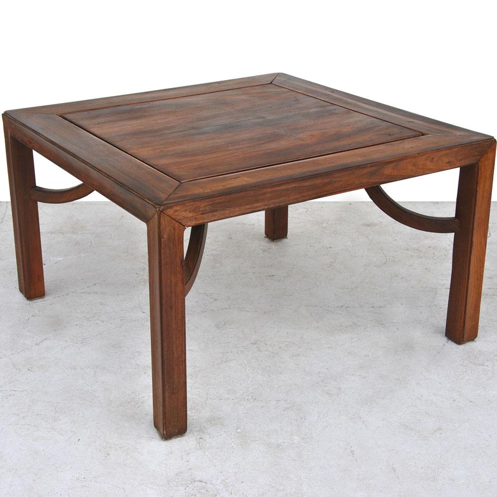 Vintage Chinese coffee side table 

Antique Asian table in a richly grained rosewood with giant arm stretcher supports.