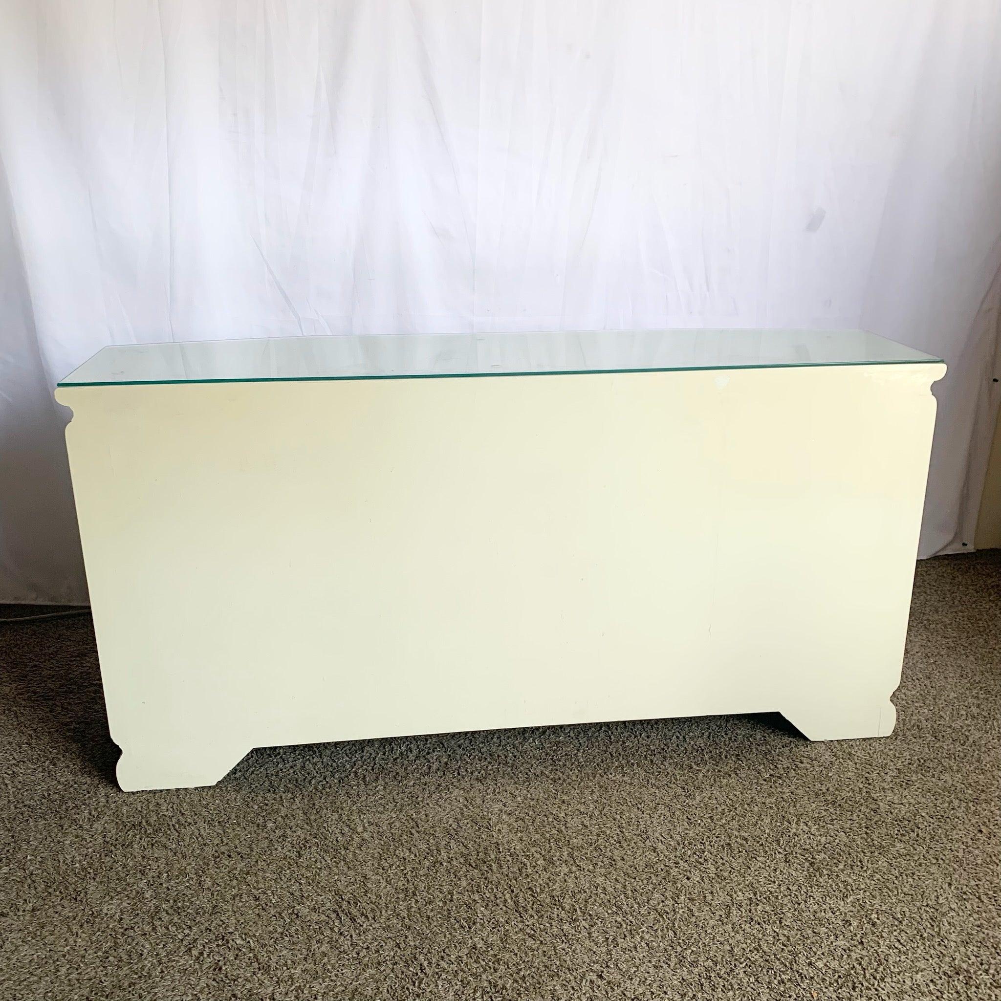 Vintage Chinese Cream Lacquered Credenza with hand-painted landscapes, glass top, and brass accents—where serene beauty meets functional design.
 

 Some discoloration to the finish as can be seen in the photos. 
 

 We sell items as acquired,