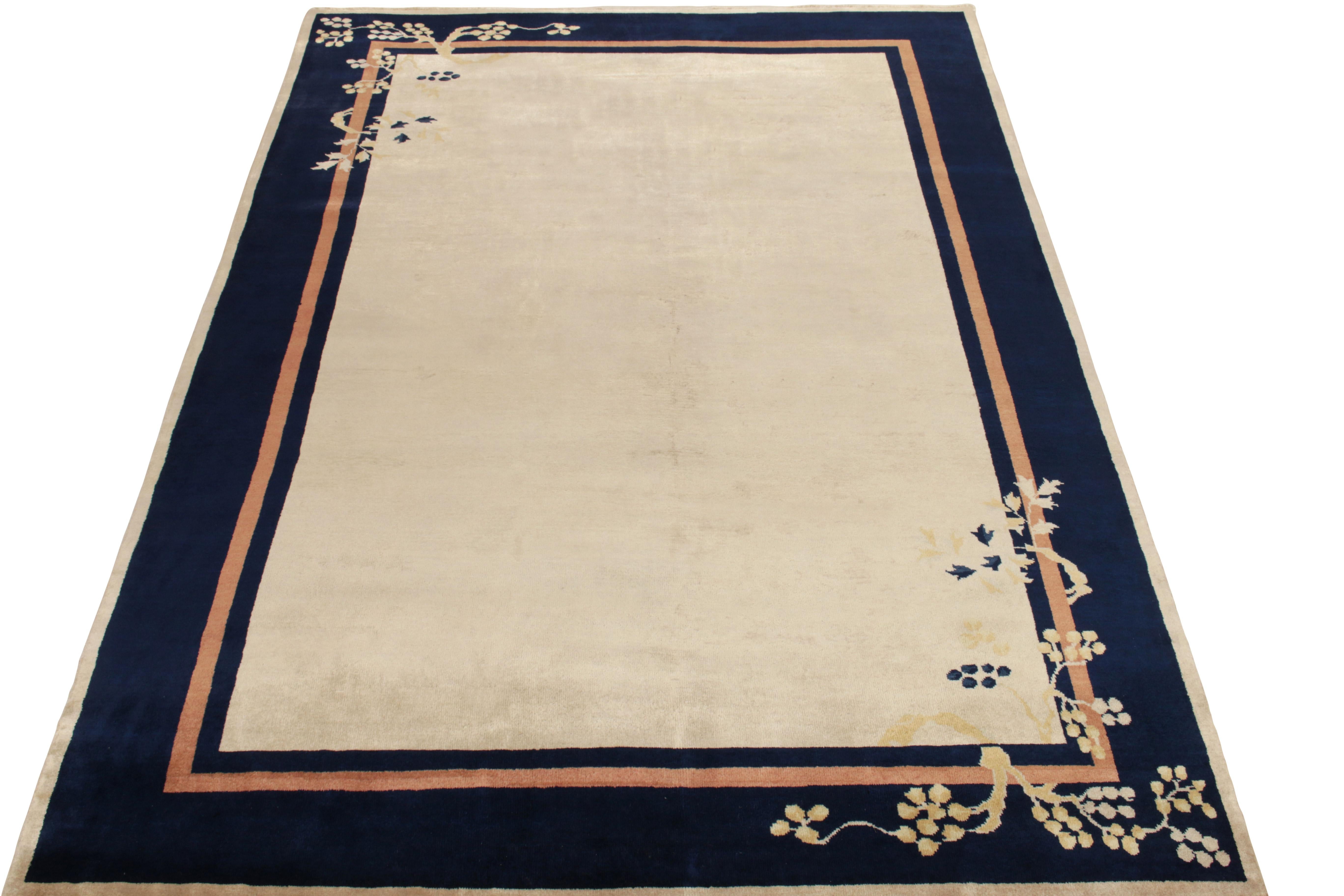Hand-knotted in wool, a 7x10 vintage piece exemplifying Chinese Art Deco rug aesthetics—among the latest to join Rug & Kilim’s Antique & Vintage collection. The bejewelled piece showcases a luscious cream open field beautifully encased in