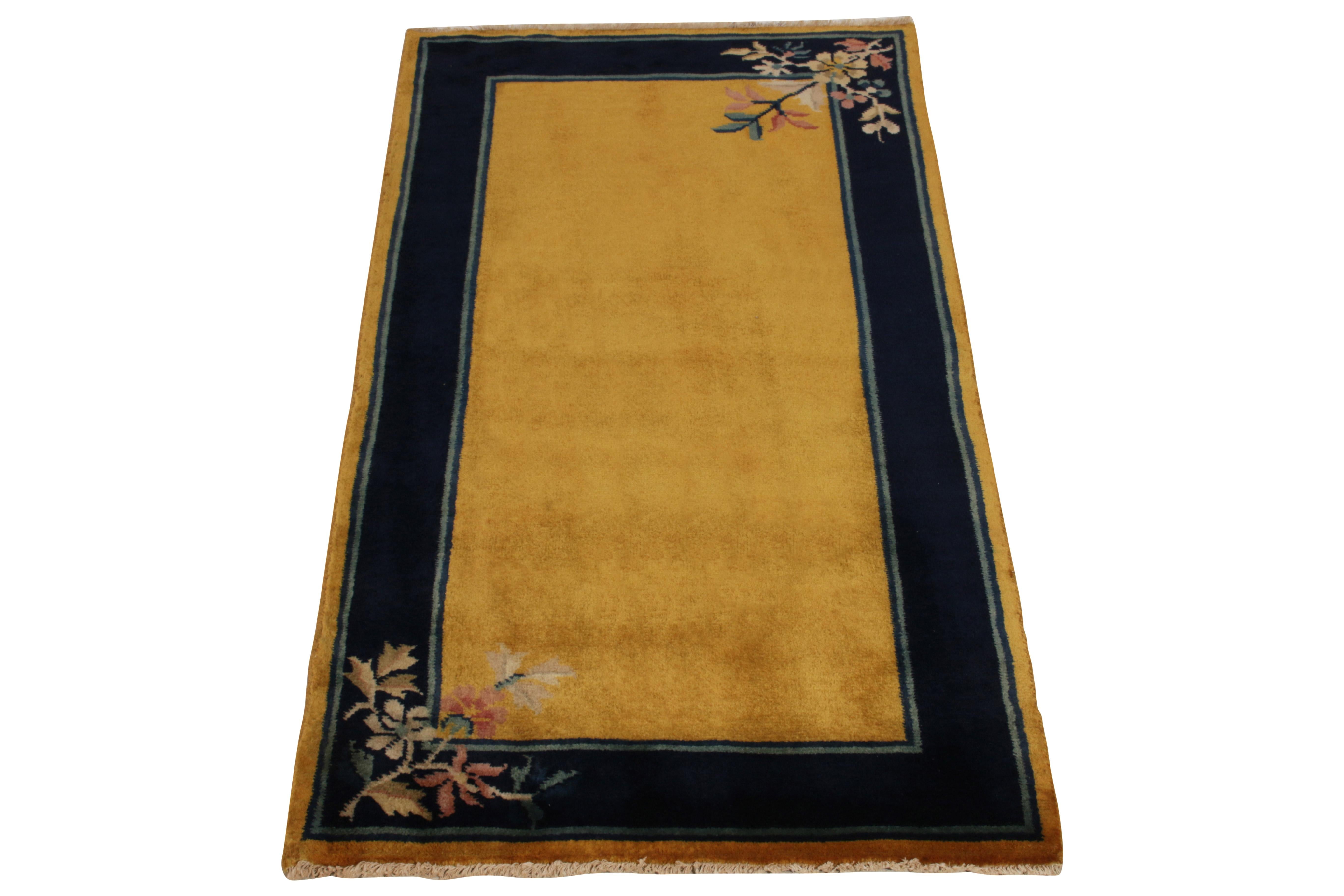 Hand-knotted in wool, a 2x5 Art Deco rug from our Antique & Vintage collection exemplifying the Chinese sensibilities of the 1920s. The floral pattern flourishing in brown, red, green tones sits comfortably on a rich blue border - sandwiched between