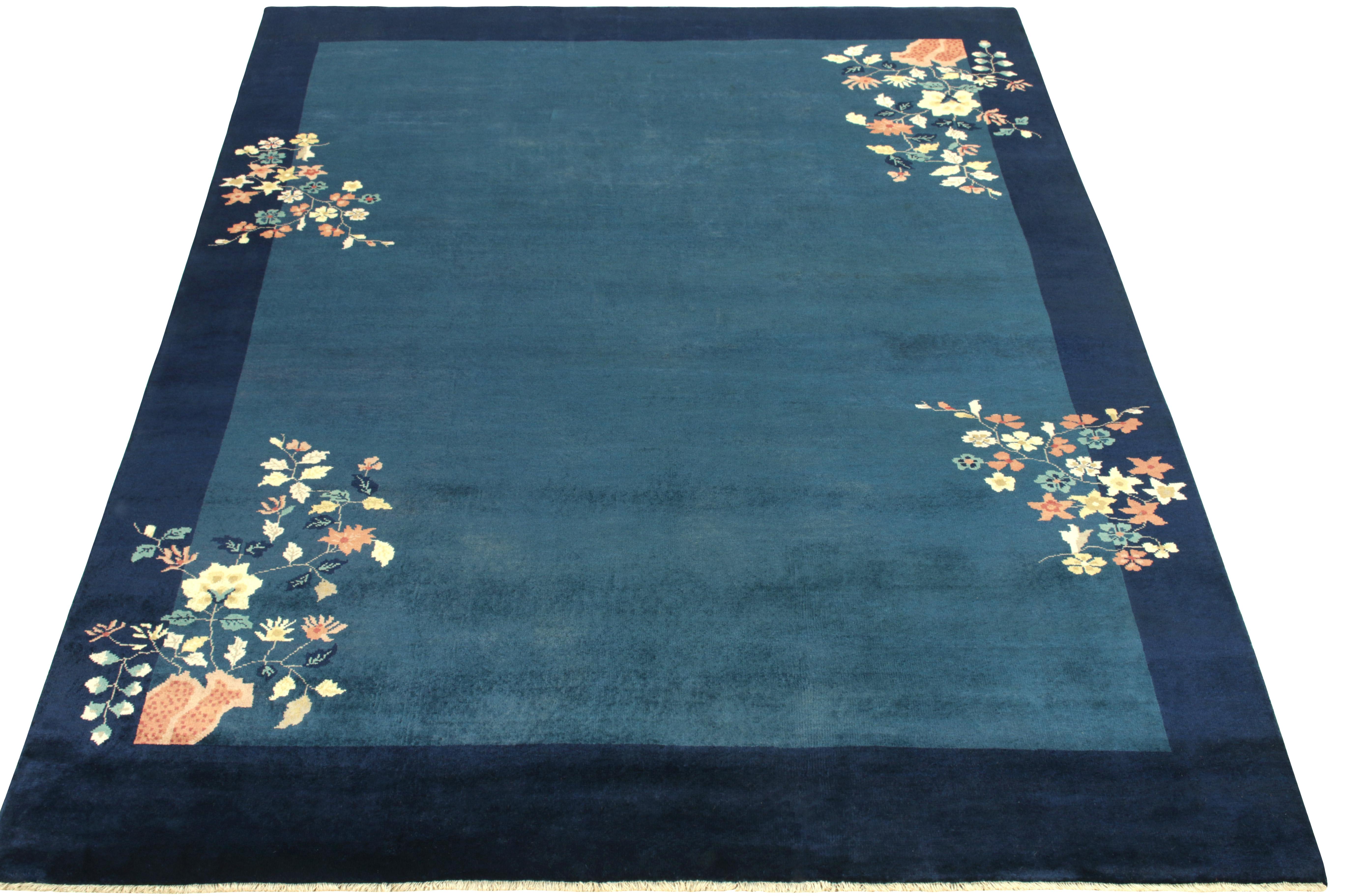 Hand-knotted in wool, a 7 x 9 vintage Chinese art deco style rug from our Antique & Vintage collection, inspired by classic sensibilities of the 1920s. The rug enjoys a healthy pile in tones of blue complementing the light dark spots on the field