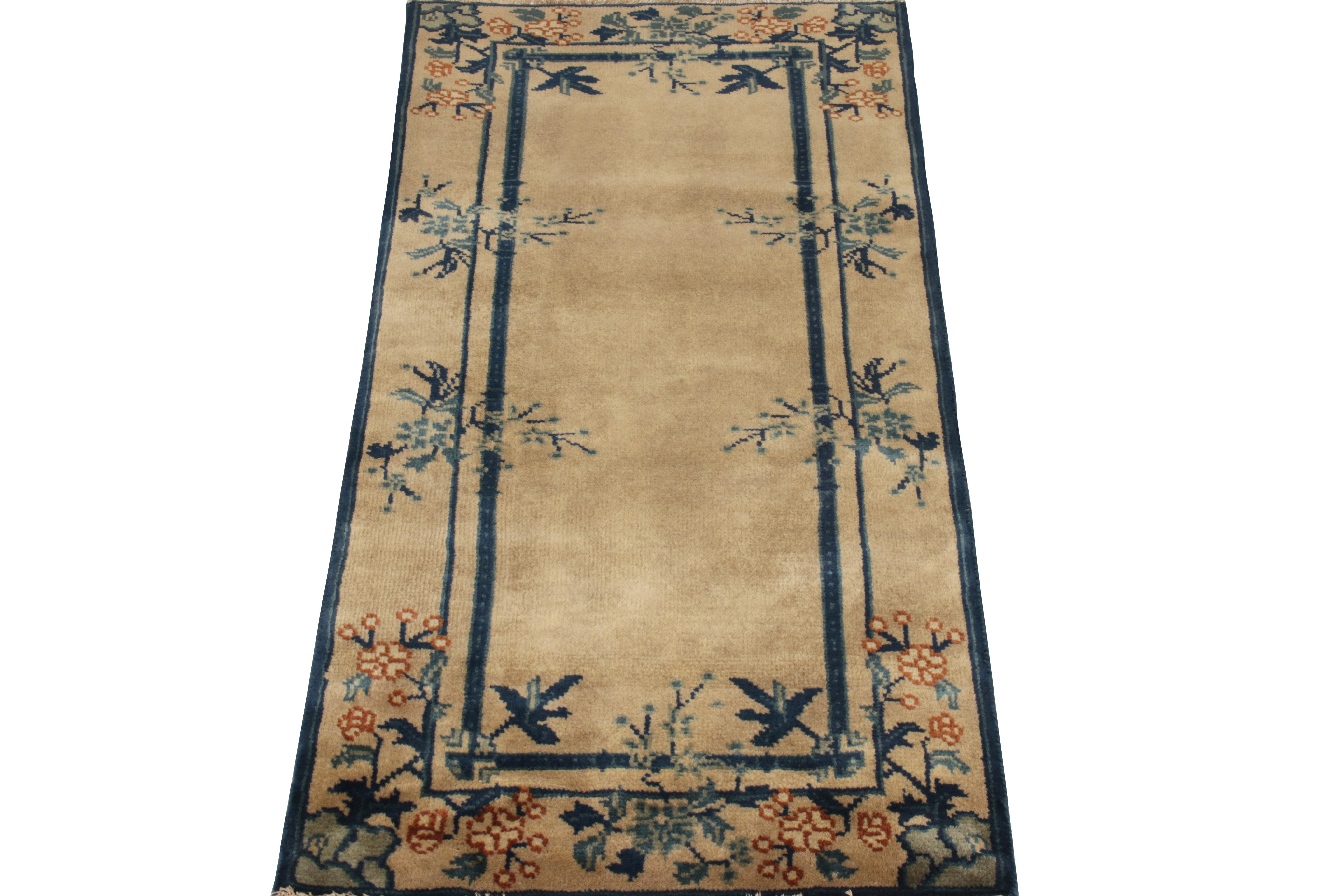 Belonging to Rug & Kilim’s Antique & Vintage Collection, a 2 x 4 vintage ode to Chinese Deco styles of the 1920s exemplifying classic frames in royal blue atop a luxurious beige-brown backdrop comfortably supporting the florals in aegean blue, teal