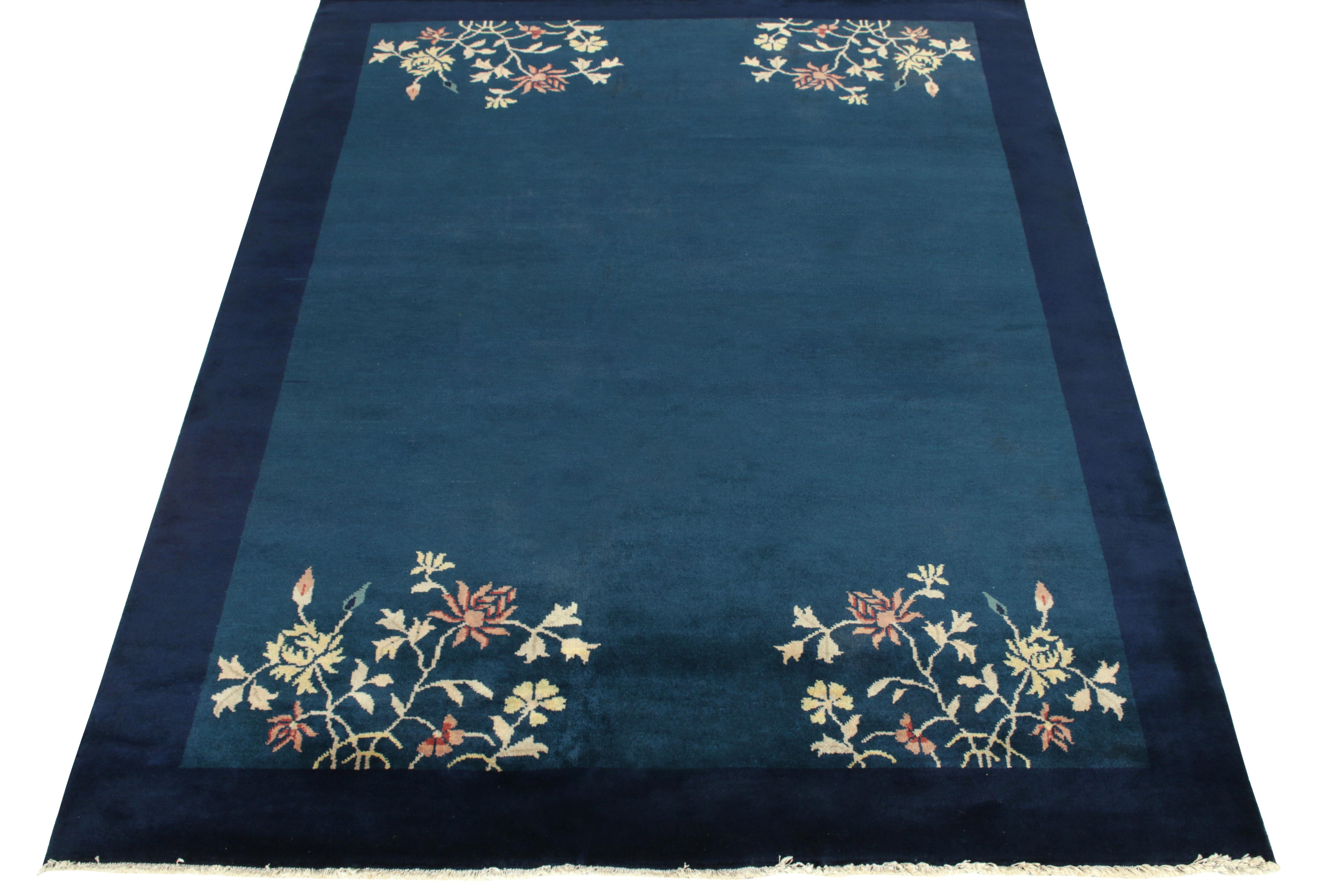 Hand-knotted in wool, a vintage 5x7 ode to Chinese art deco rug from our Antique & Vintage collection, inspired by classic sensibilities of the 1920s. The rug enjoys a healthy pile in tones of blue complementing the light dark spots on the field for
