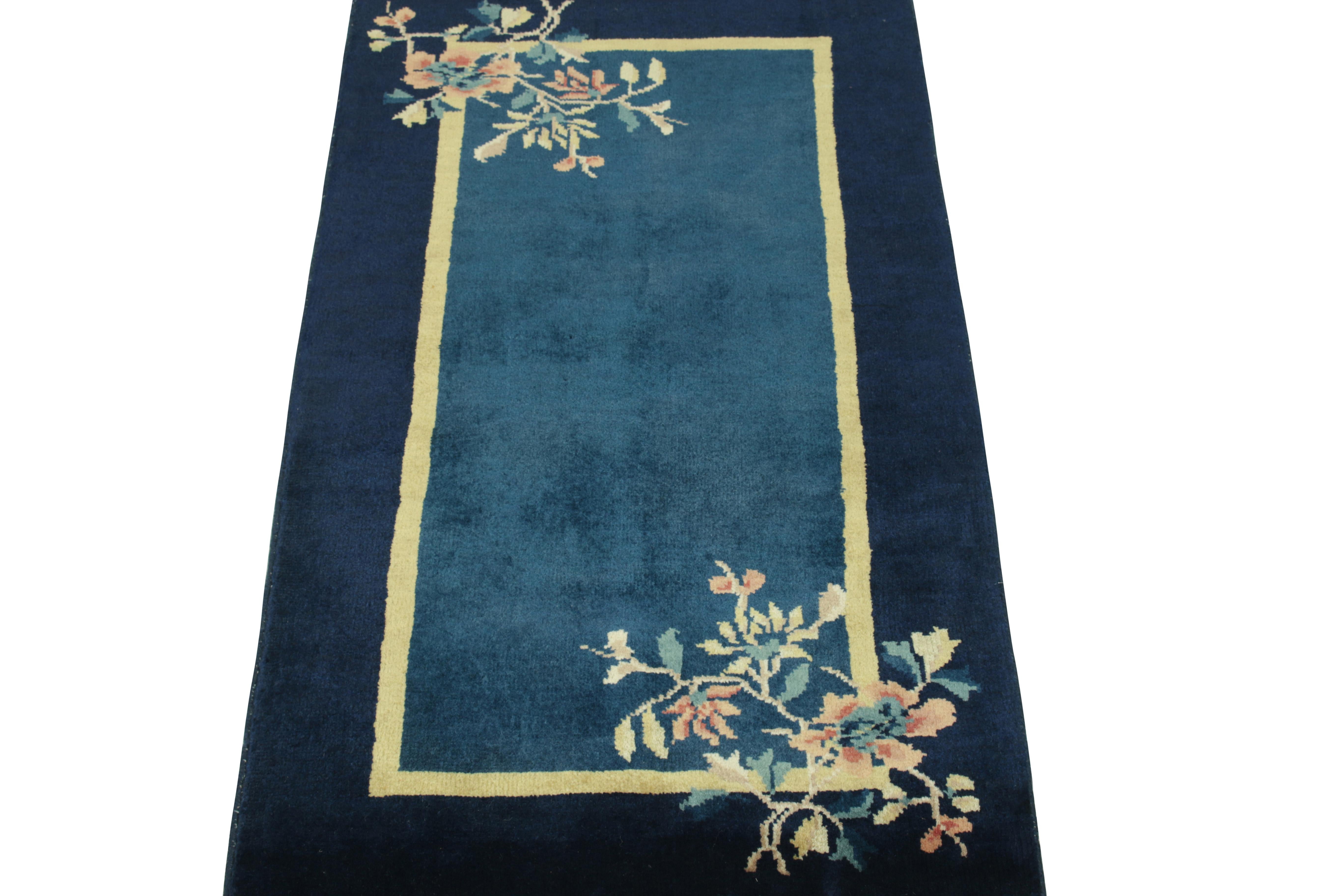 Boasting a floral pattern in teal, reddish orange & sky blue tones in the outer border, a Chinese Deco style vintage rug with mild light-and-dark spots in blue tones connoting a very classic, lustrou appeal like the 1920s style of inspiration.