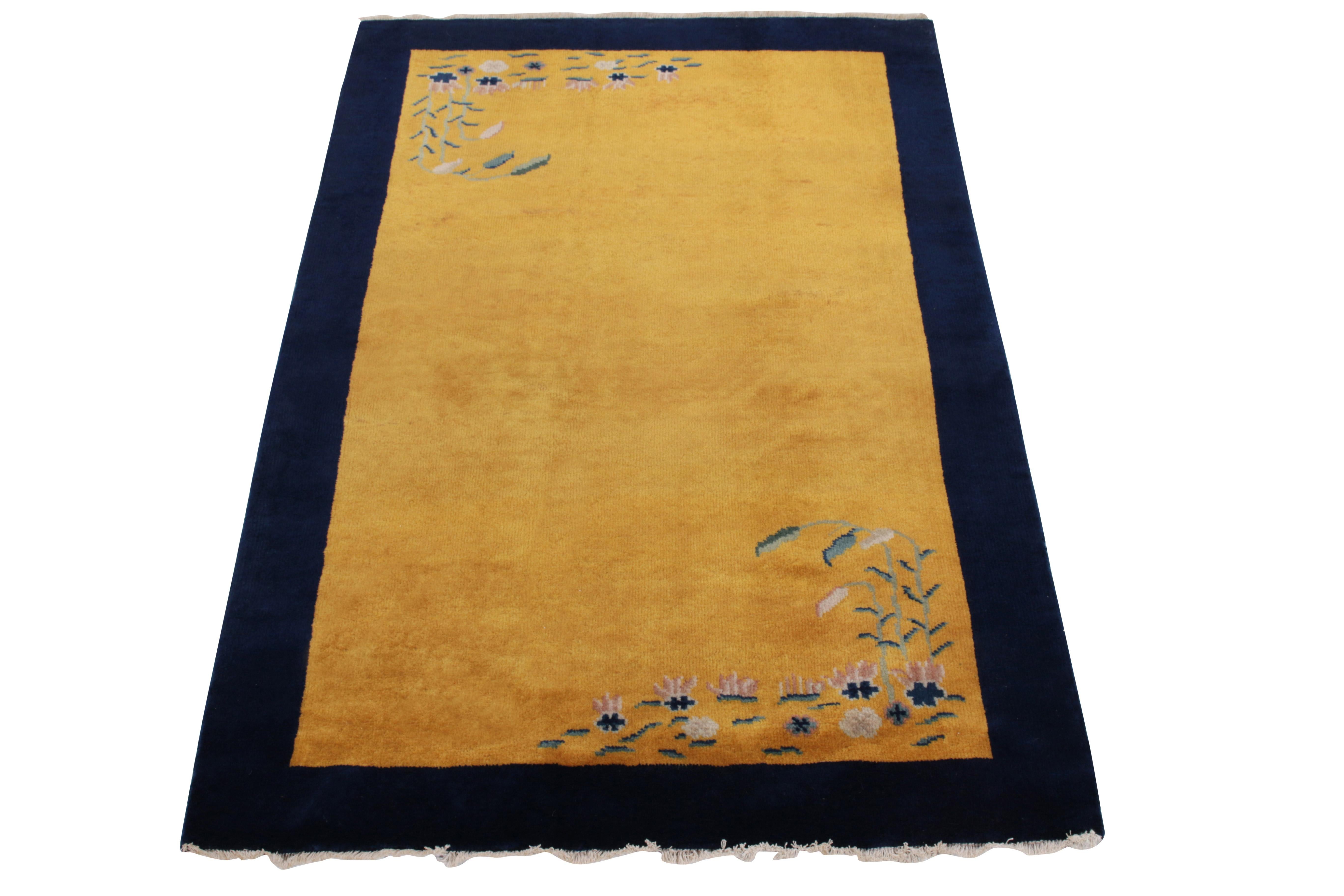 Hand-knotted in wool, a 3 x 5 vintage rug from our Antique & Vintage collection exemplifying the Chinese Deco sensibilities inspired by the 1920s. The floral pattern flourishing in light & dark blue tones with subtle green foliage rests harmoniously