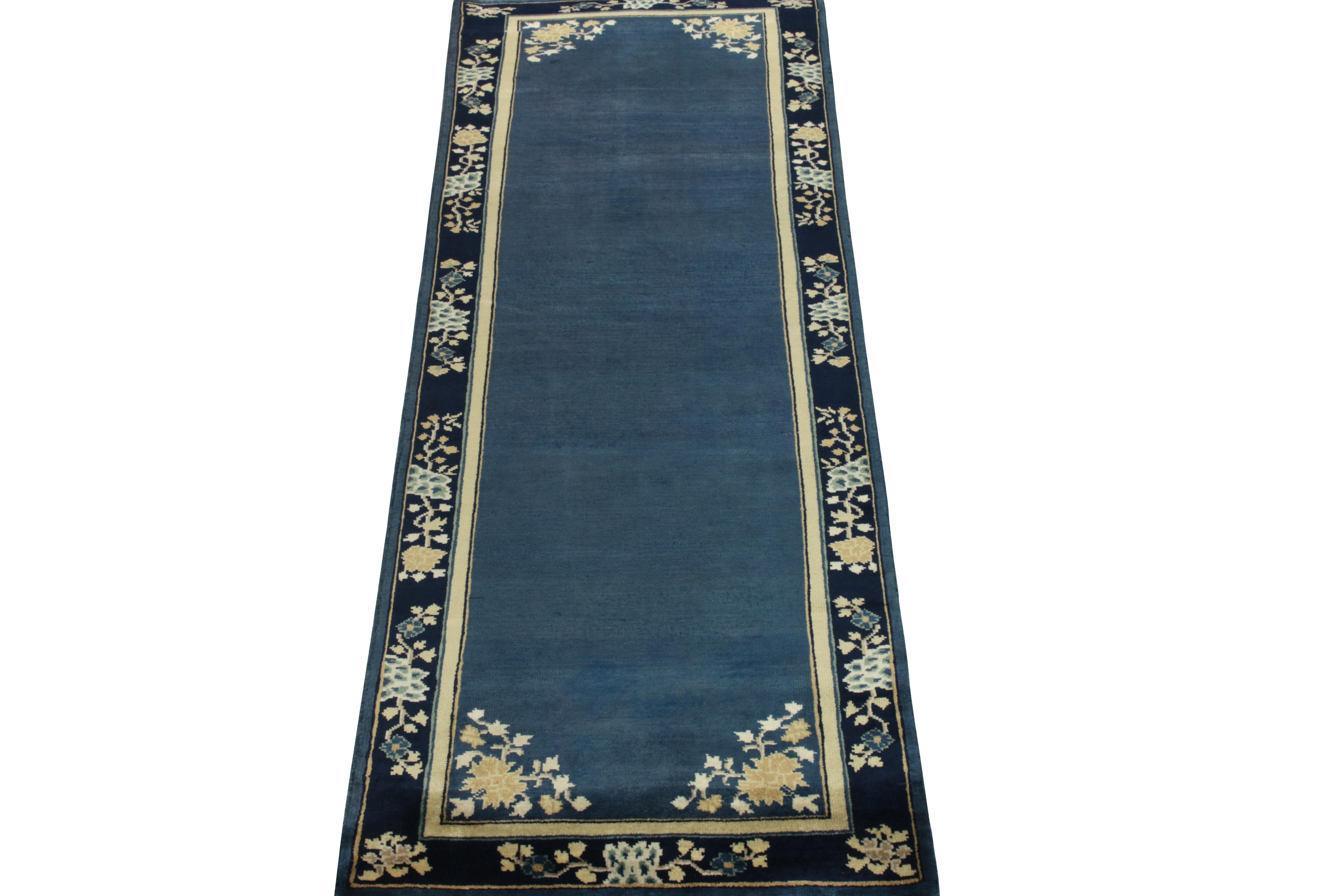 A 3x8 hand-knotted vintage runner connoting Chinese art deco inspirations of the 1920s, from the newest line of Rug & Kilim’s Antique & Vintage collection. The clean blue open field enjoys light dark spots for an interesting visual appeal on scale