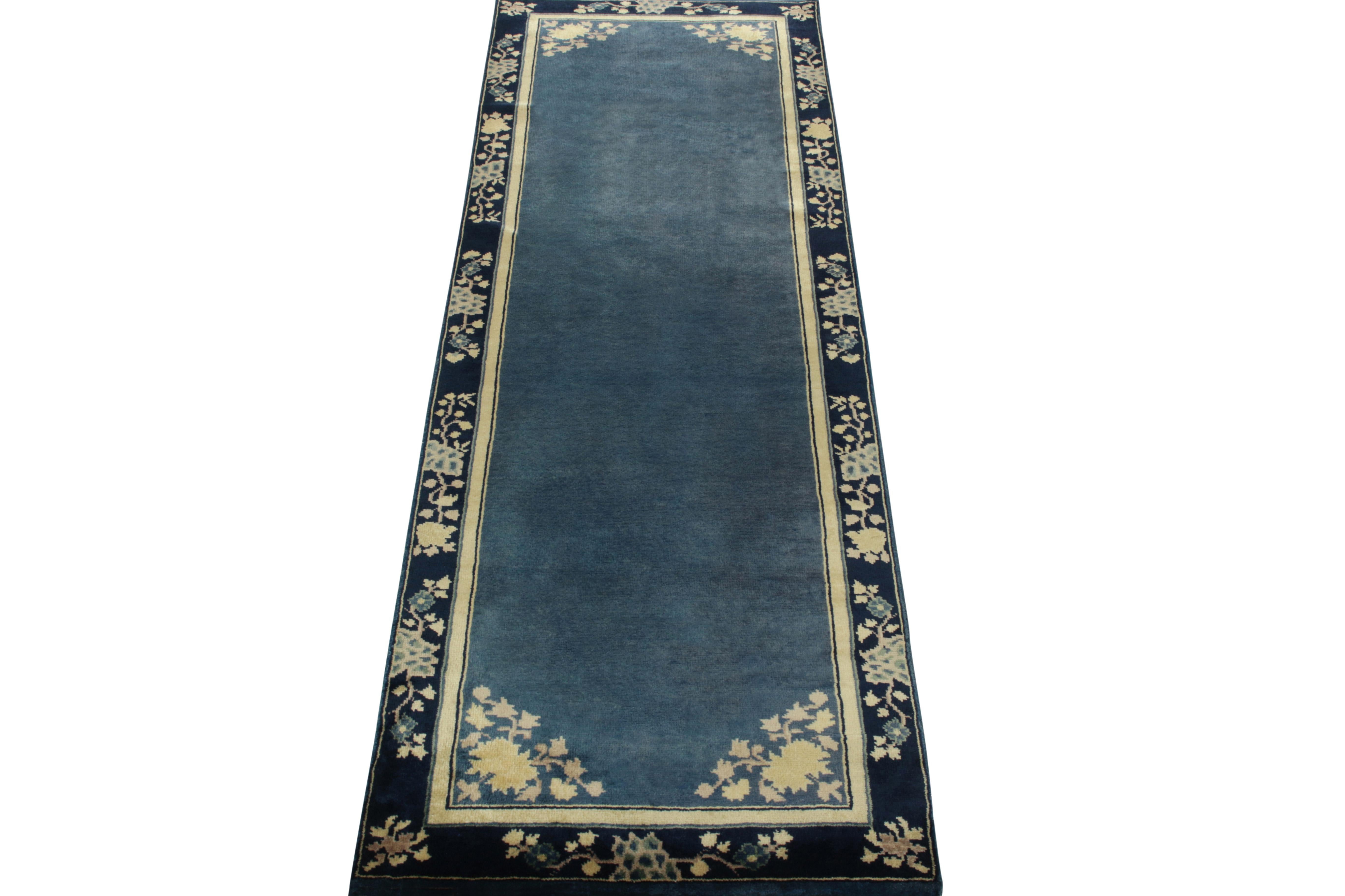 A 3x8 hand-knotted vintage runner connoting Chinese art deco inspirations of the 1920s, from the newest line in Rug & Kilim’s Antique & Vintage collection. The clean blue open field enjoys light dark spots for an interesting visual appeal on scale