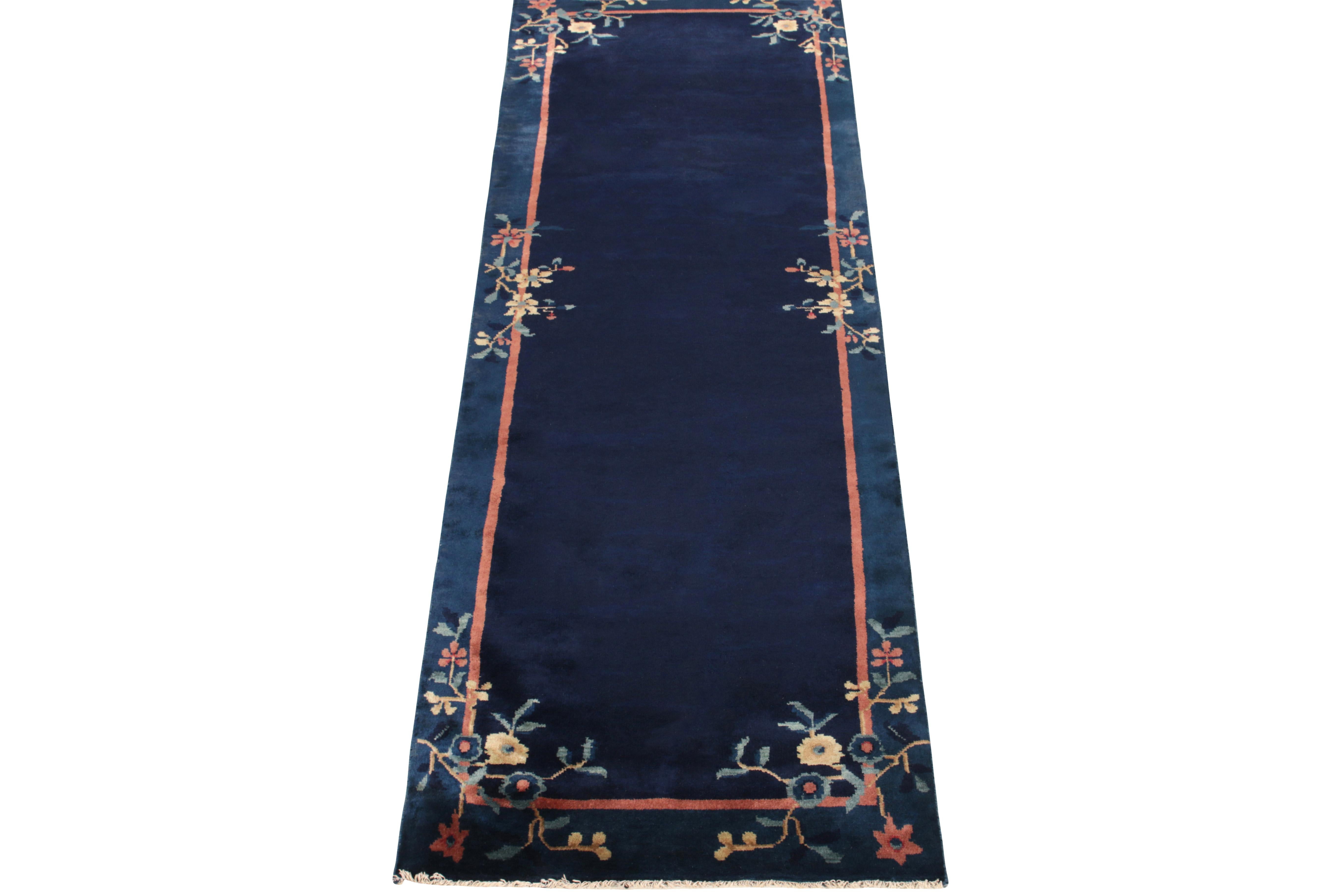 Boasting a floral pattern in yellow, red & sky blue tones in the outer border, a Chinese Deco style vintage runner observing light-dark spots in blue tones connoting a very classic appeal of the 1920s. Further enjoying a fine light red border