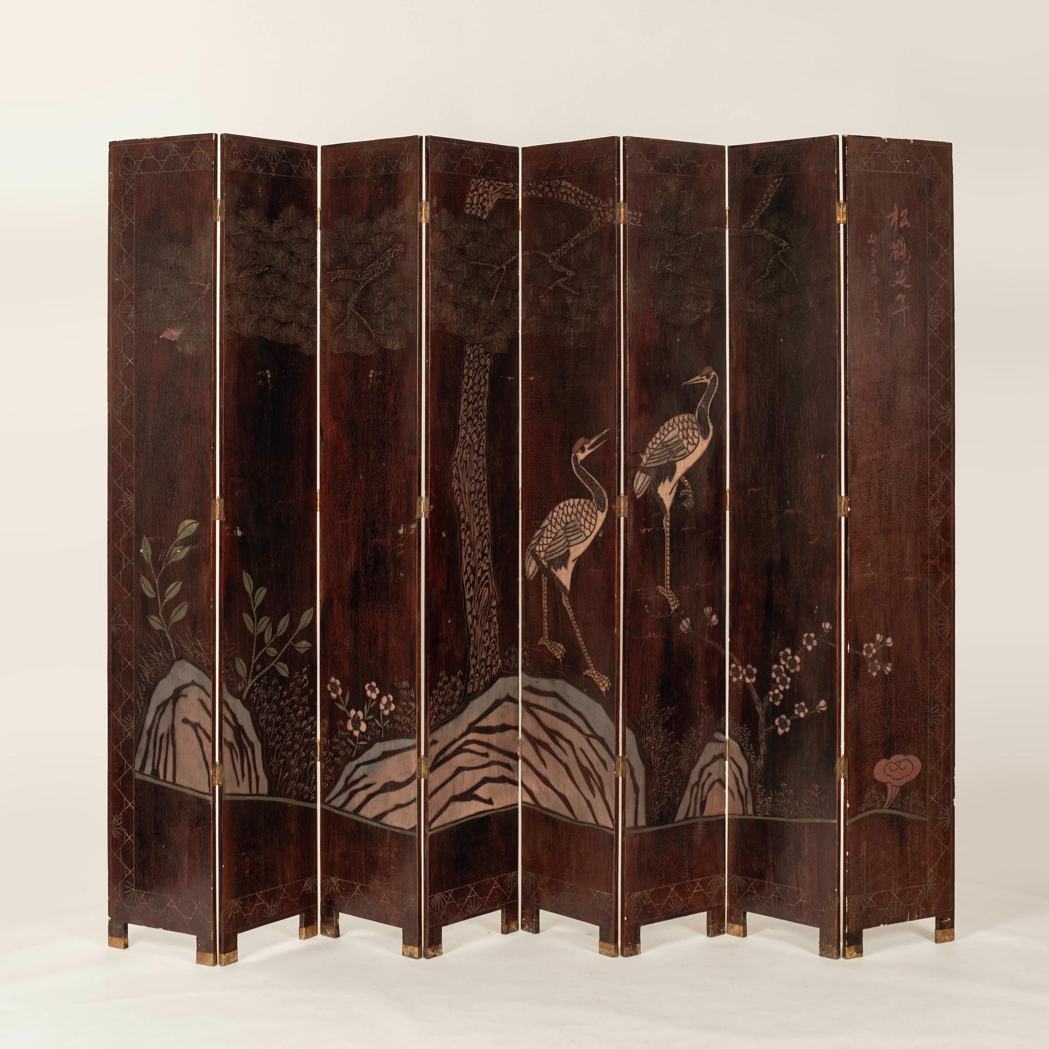 Vintage Chinese eight panel coromandel screen composed of wood and lacquer. This screen depicts daily life on one side and a landscape with birds and fauna on the other side. 