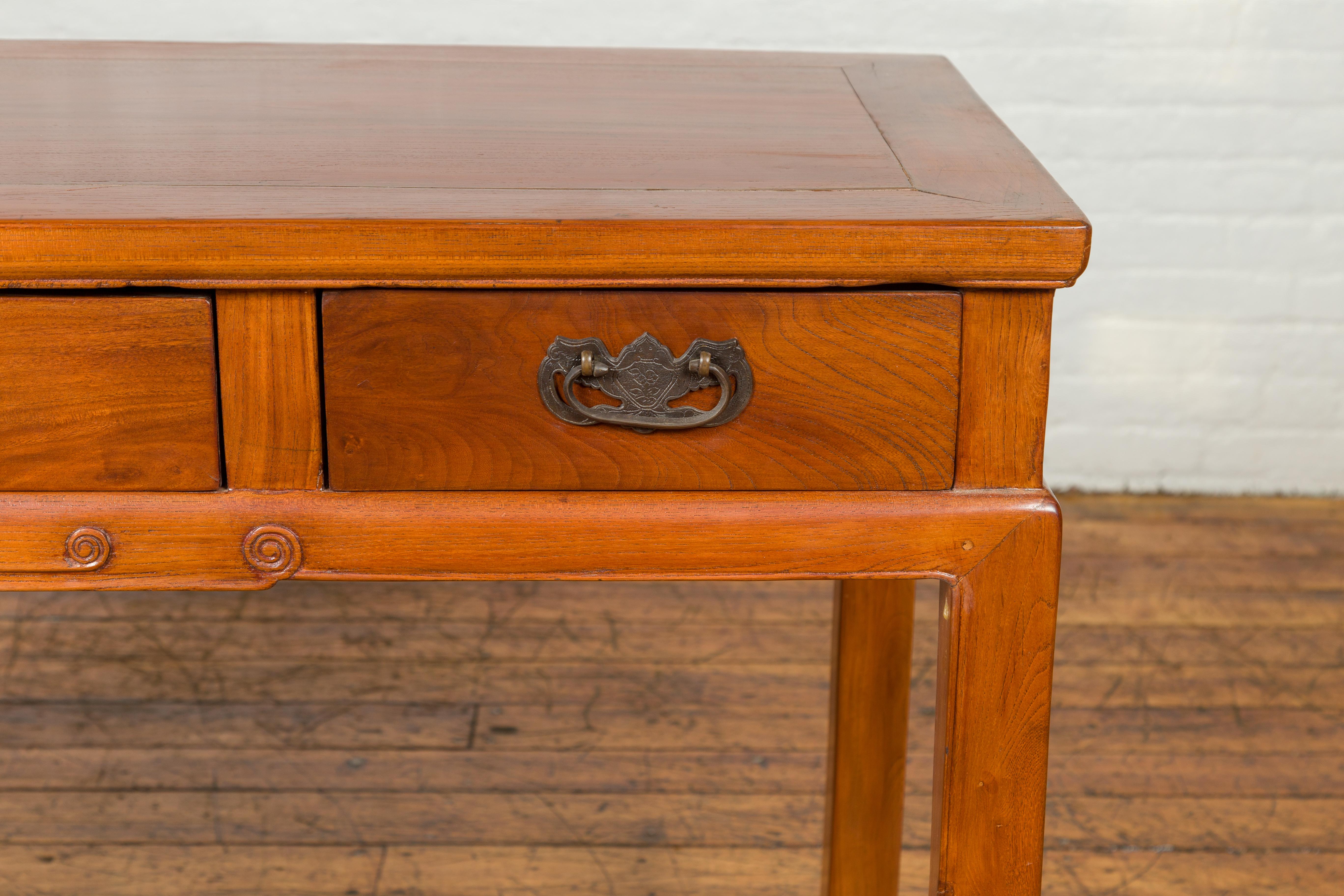 Vintage Chinese Elm Desk with Three Drawers, Iron Hardware and Swirling Motifs In Good Condition For Sale In Yonkers, NY