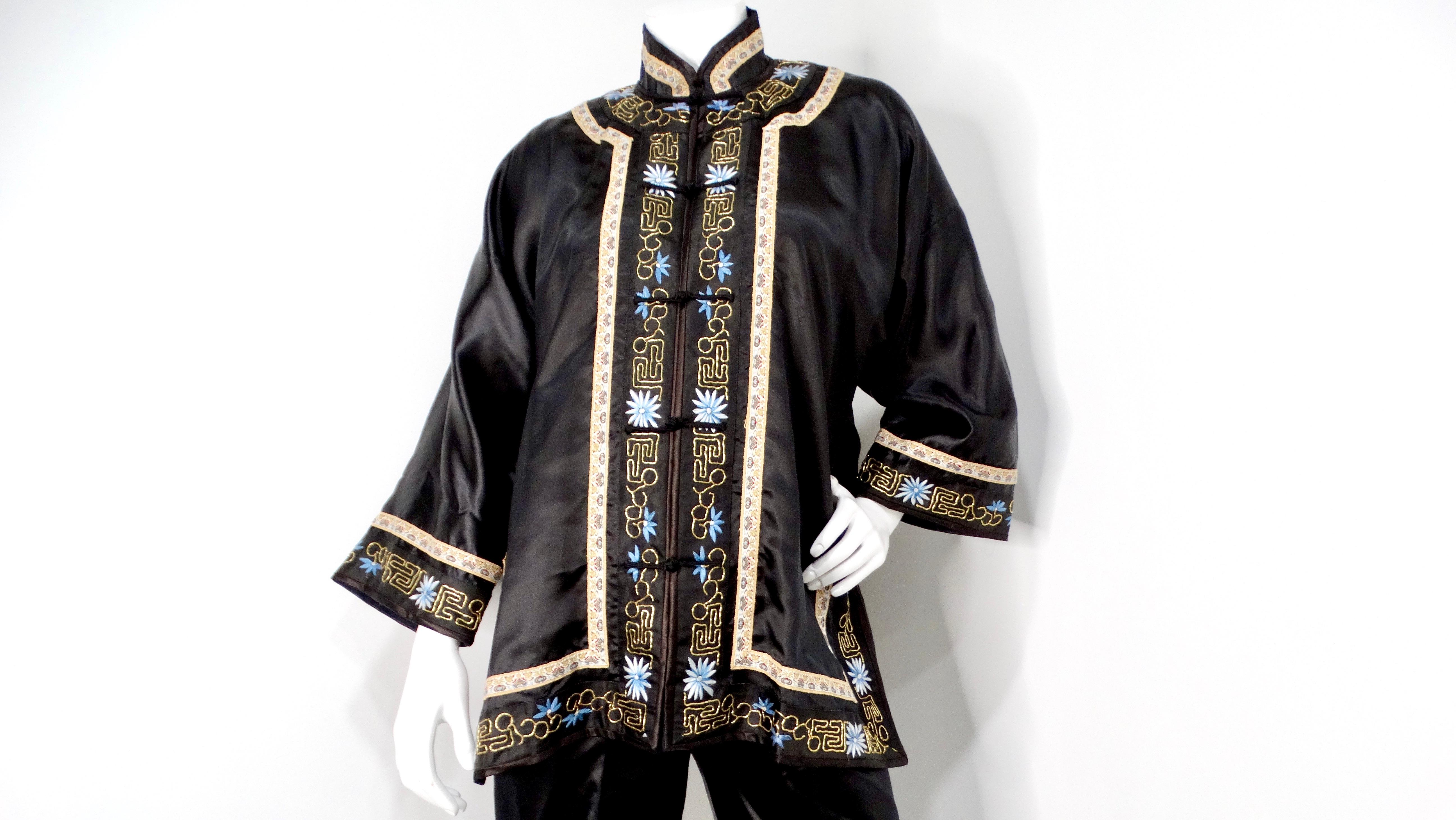 Elevate your wardrobe with this exquisite Vintage Chinese Embroidered Black Silk Jacket and Pant Set, a timeless ensemble that seamlessly blends traditional craftsmanship with modern elegance. The intricate embroidery features vibrant floral motifs