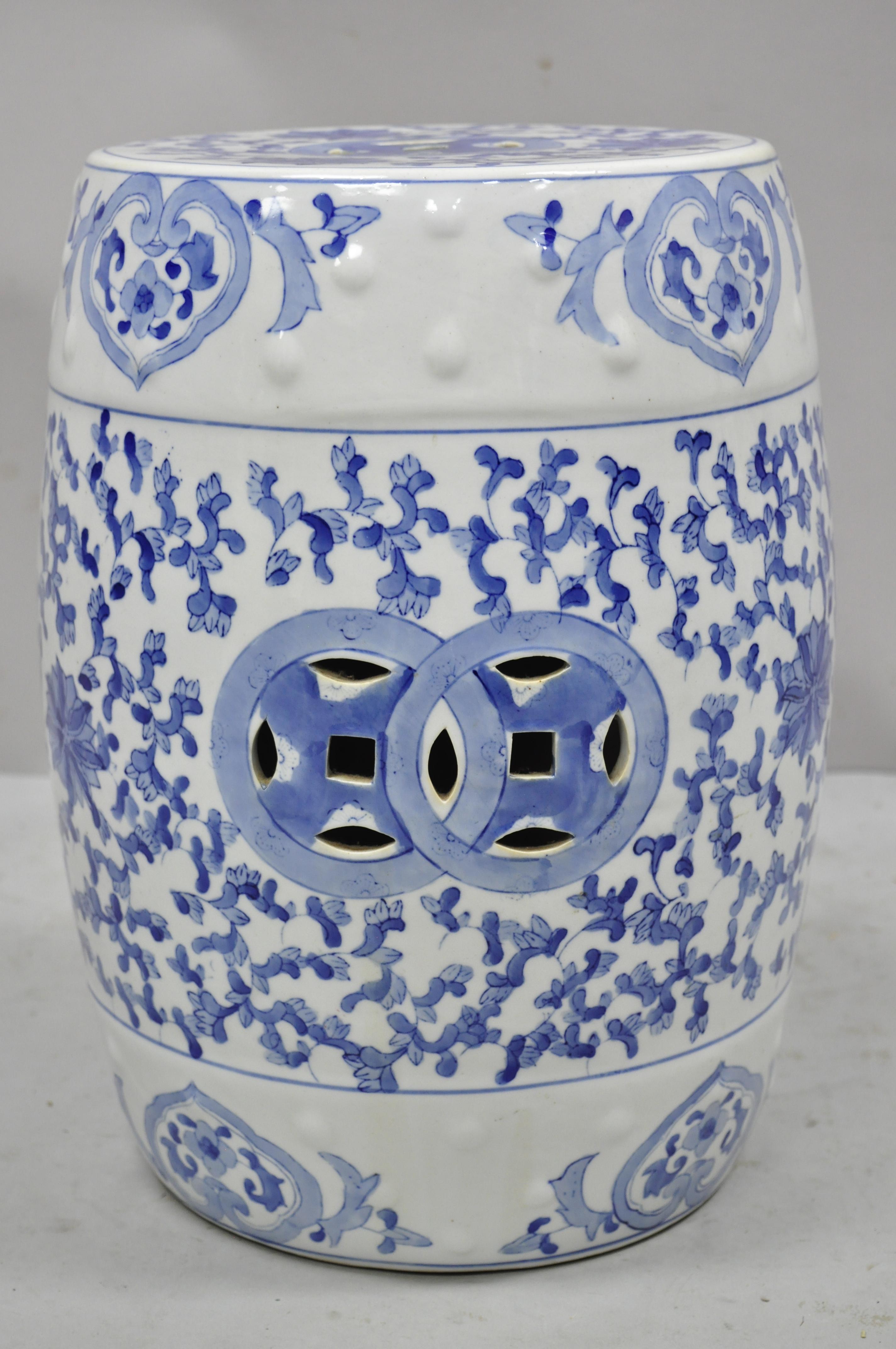 Vintage Chinese Export Porcelain blue and white garden drum seat stool with flowers. Circa late 20th century. Measurements: 17.5