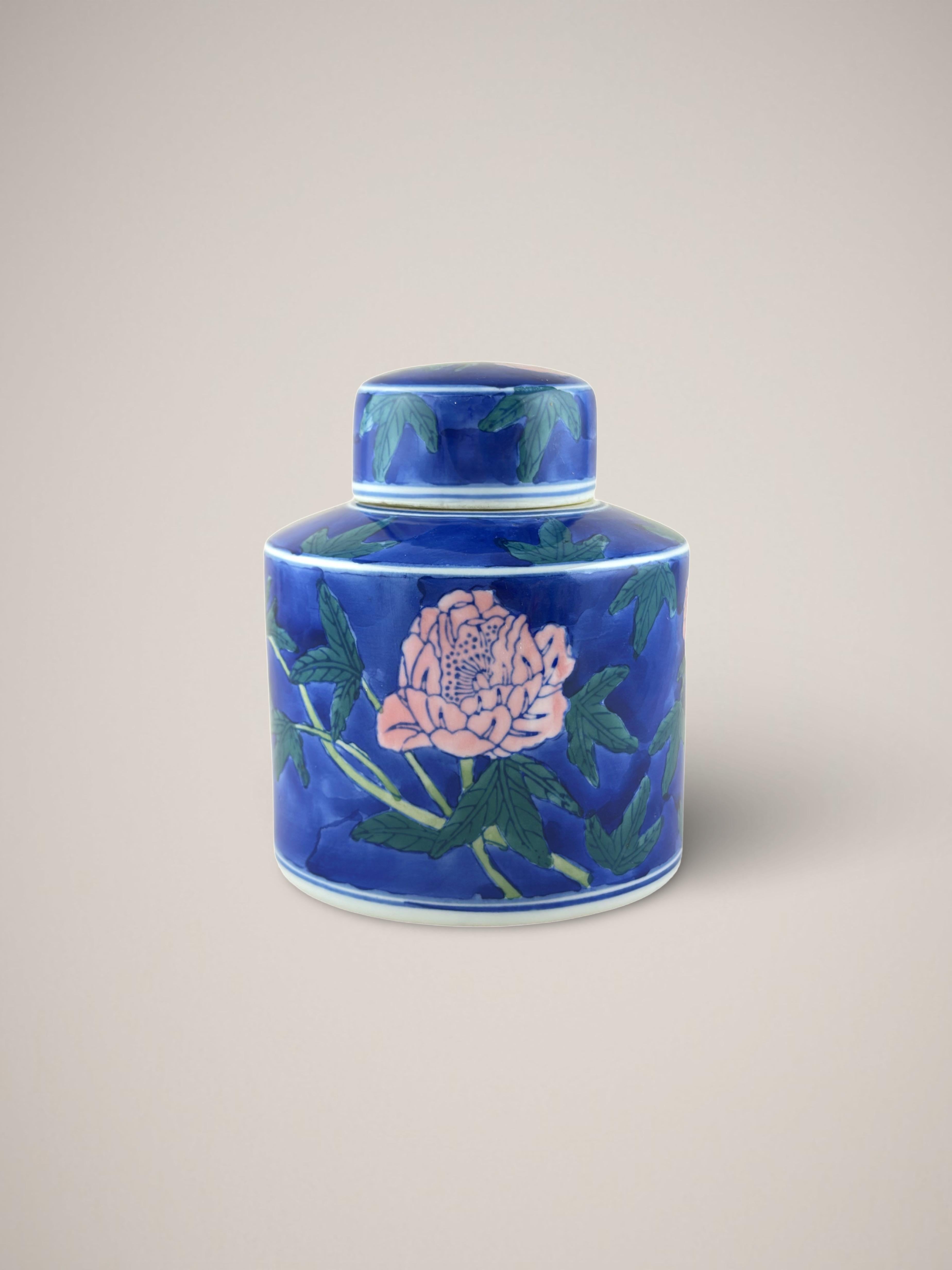 Vintage Chinese ginger jar—a bright and colorful modern 'Famille Rose' iteration, crafted in China towards the latter end of the 20th century, specifically during the 1980s.

Decorated with an expressive hand-painted scene of a singular peony flower
