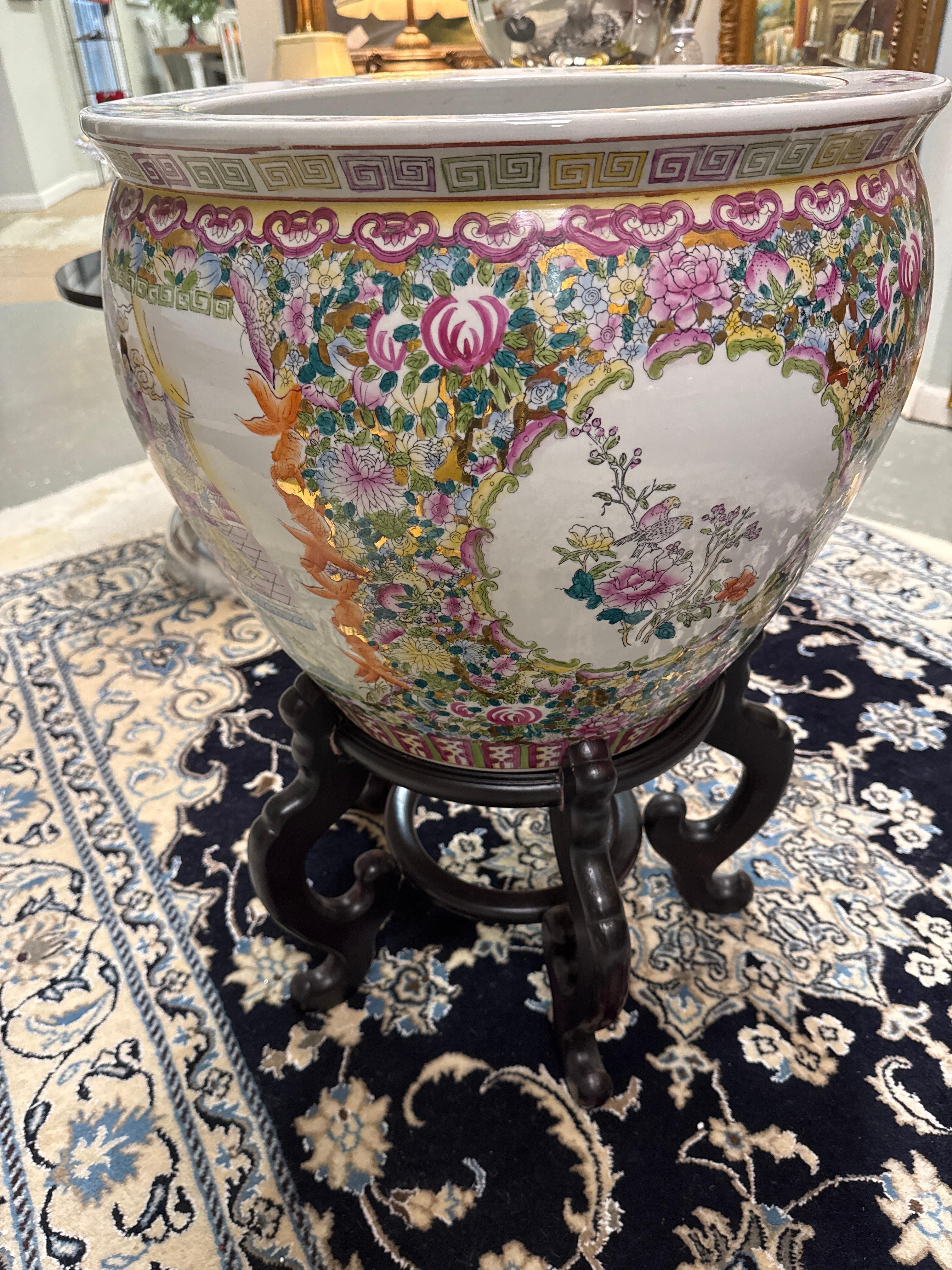 Gorgeous of Chinese 20th century large Famille Rose porcelain fishbowl planter. Chinese Rose Medallion Fish Bowl-Koi-Asian Court-Floral Pattern-
The first scene on the bowl is of the Emperor in the garden, along with family, and nobility.
The second