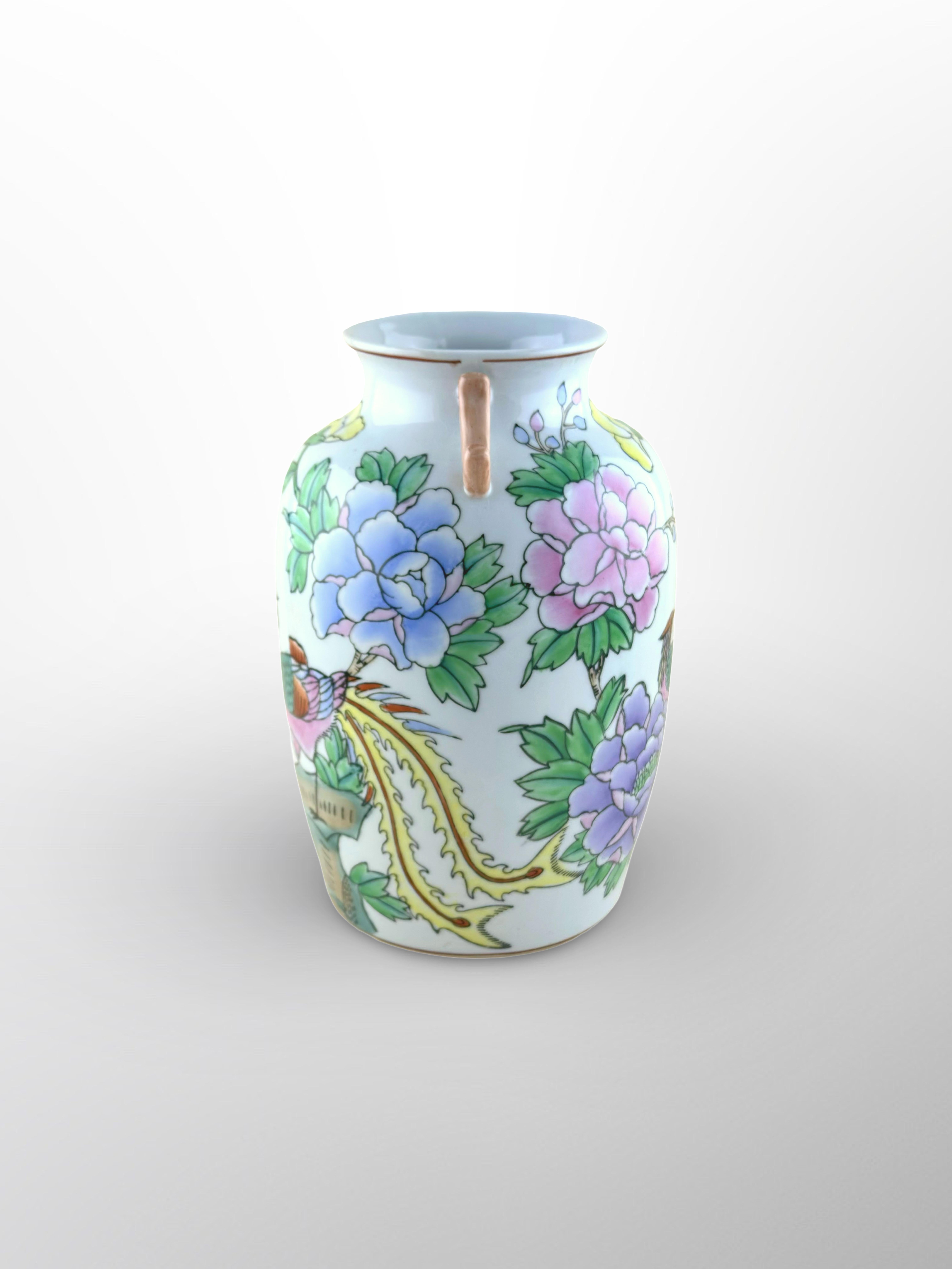 A vintage Kangxi-style Chinese vase, crafted in China around the latter half of the twentieth century, around the 1970s. 

The substantial porcelain vase was created in the 'Hu' shape, with a thick, bulbous body that extends upwards and transitions