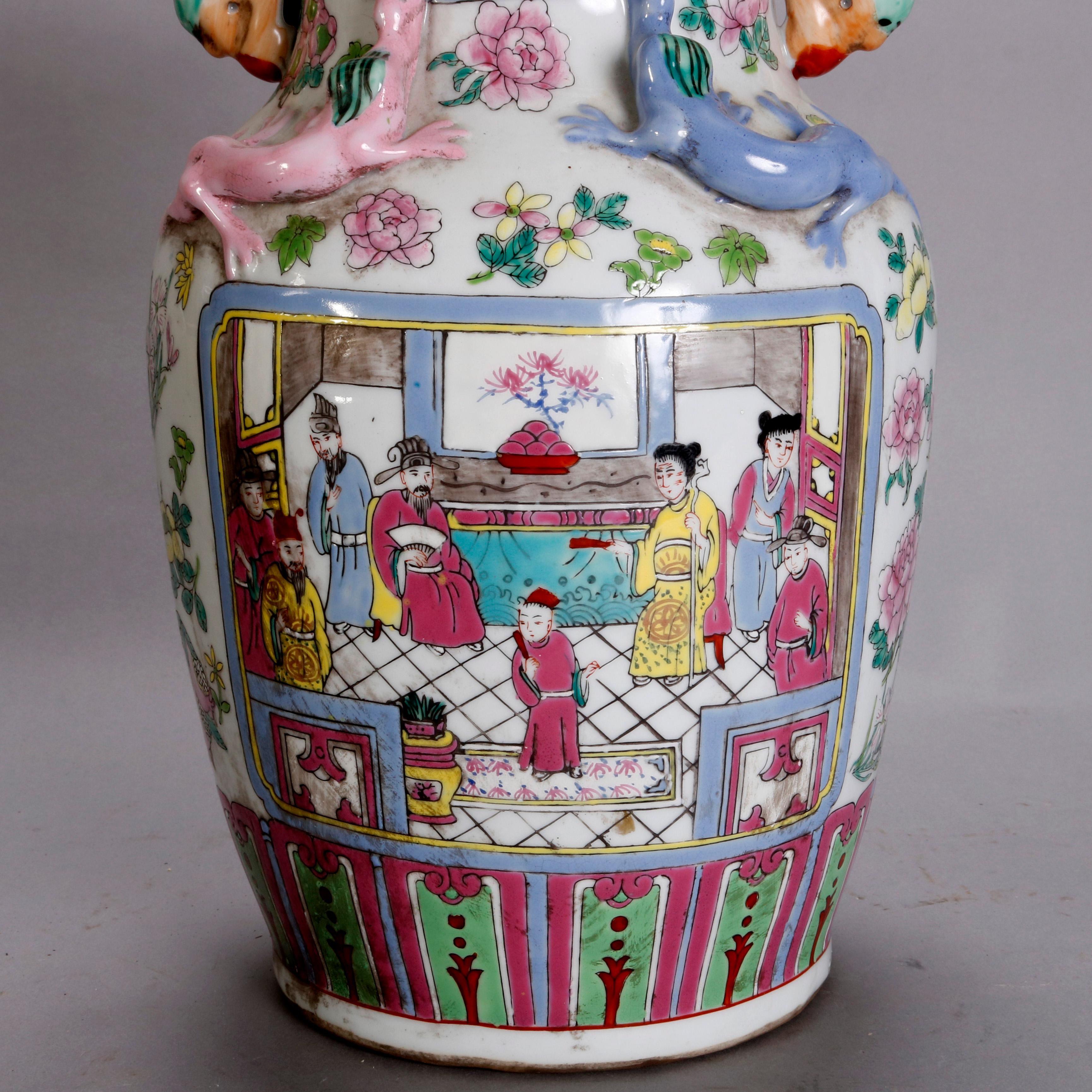 A vintage Chinese porcelain vase offers bulbous form with flared neck having reserves of genre scenes with figures, applied lizards and double animal form handles surmounting floral decorated body with genre reserve, circa 1940

***DELIVERY NOTICE –