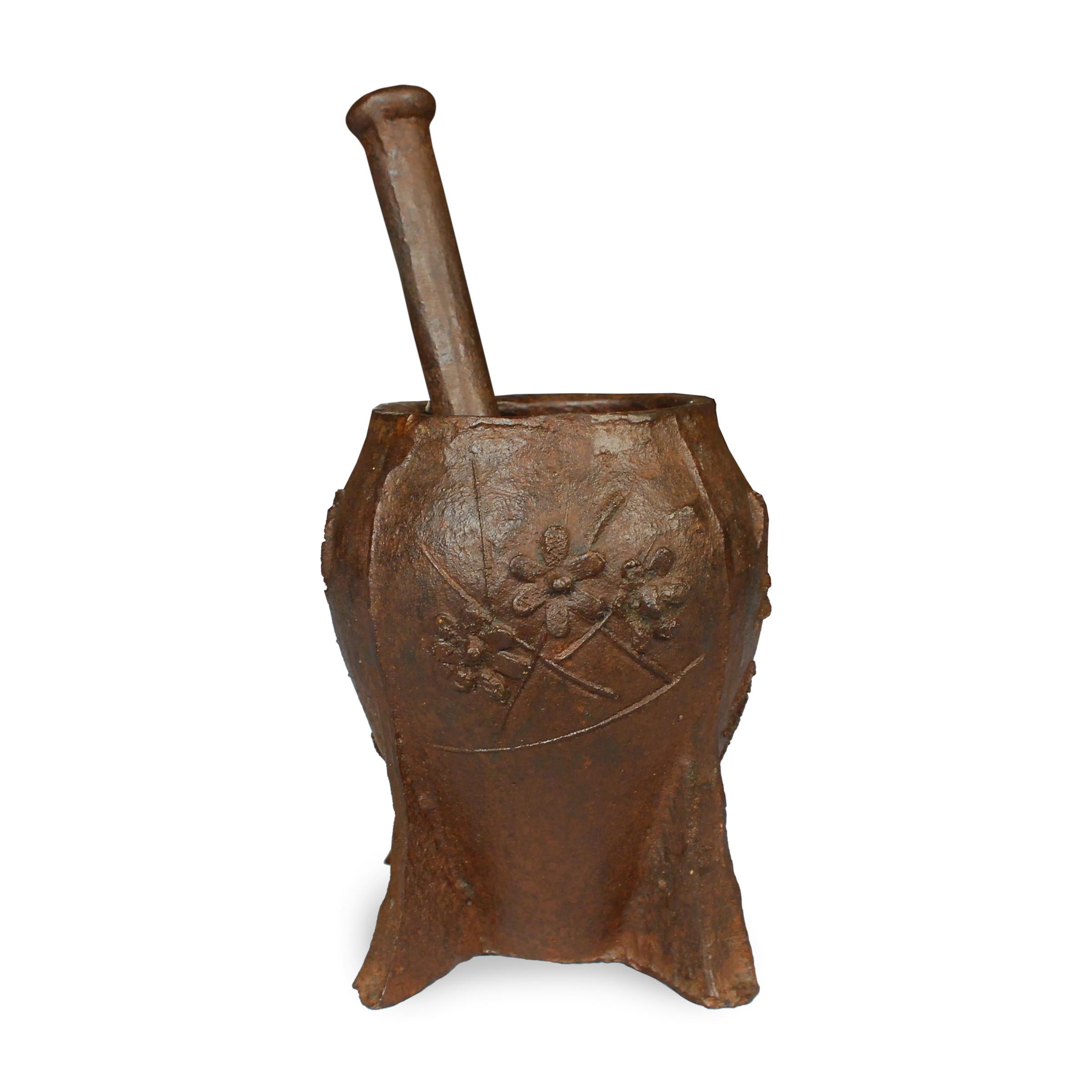 This vintage cast iron mortar from China's Shanxi province is patterned in low relief with a simple floral design. Originally used in a traditional apothecary to create herbal medicines, we love this piece as an unexpected vase or cachepot.