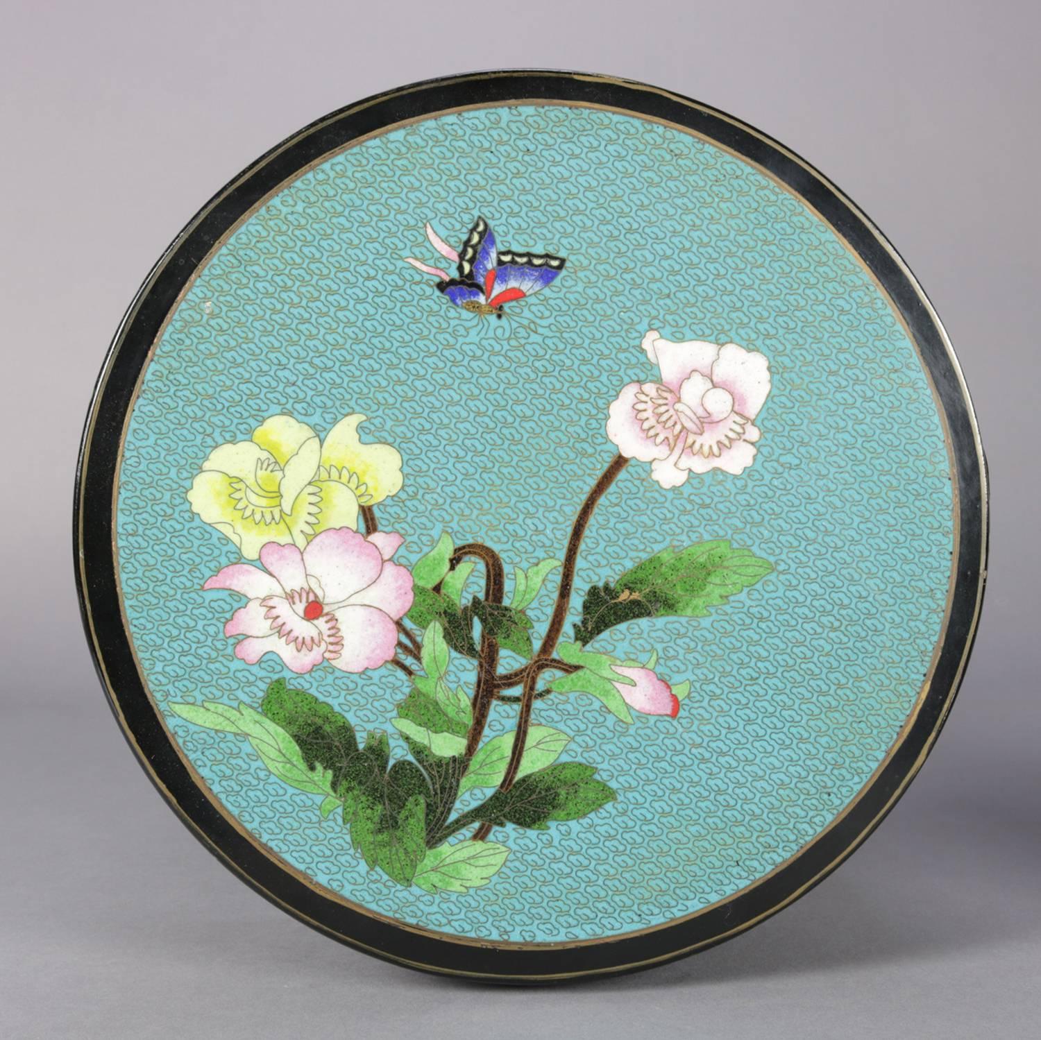 Vintage round Chinese plant stand features Cloisonne enameled top with garden flower and butterfly decoration, seated in floral and Greek Key decorated black lacquer frame, 20th century

Measures - 32
