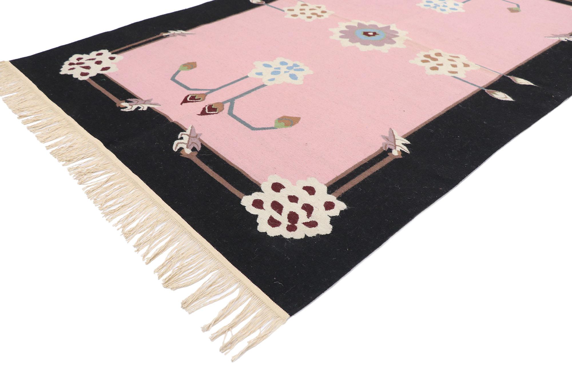 77814 vintage Chinese Floral Kilim rug 04'02 x 06'03. This hand-woven wool vintage Chinese kilim rug features a color blocked field and border festooned with gorgeous floral motifs. Four chrysanthemums and buds elegantly float in the field around a