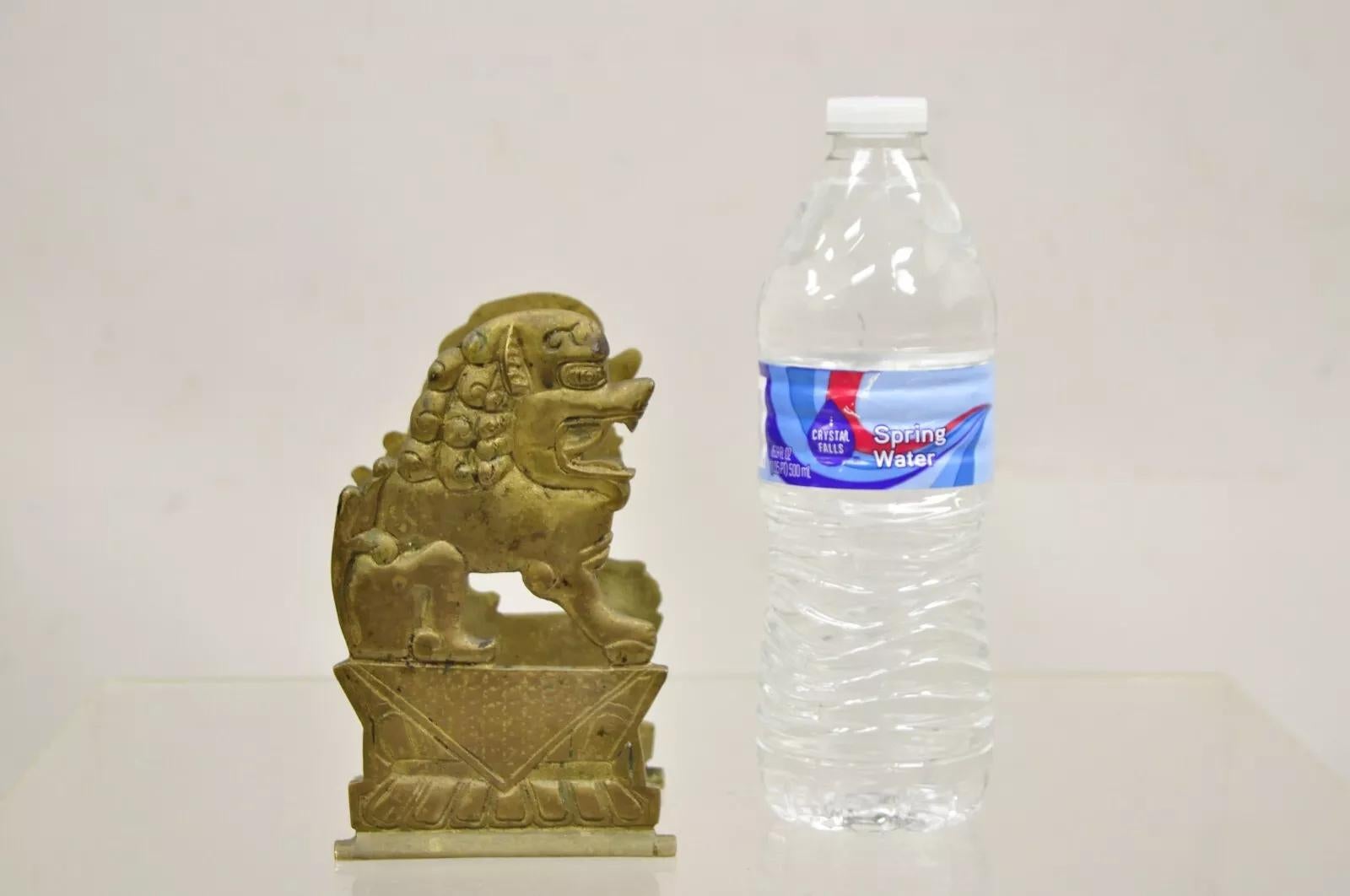 Vintage Chinese Foo Dog Solid Brass Figural Bookend. Circa Mid 20th Century. Dimensions : 6