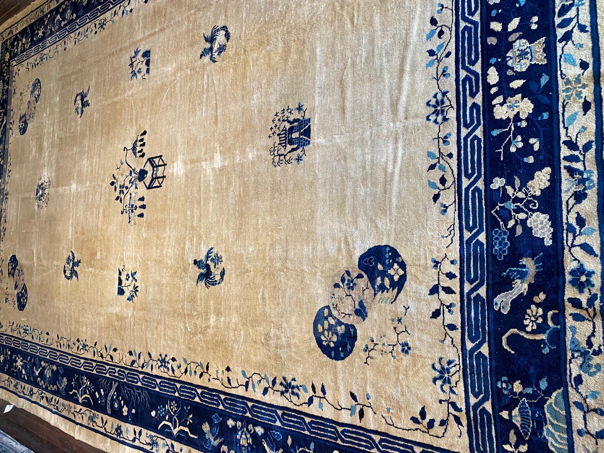 Immerse yourself in the timeless elegance of a Classic Early Twentieth Century Chinese Rug. This exquisite masterpiece is crafted with utmost precision, showcasing a masterful combination of shades of blue and cream. The subtle variations and