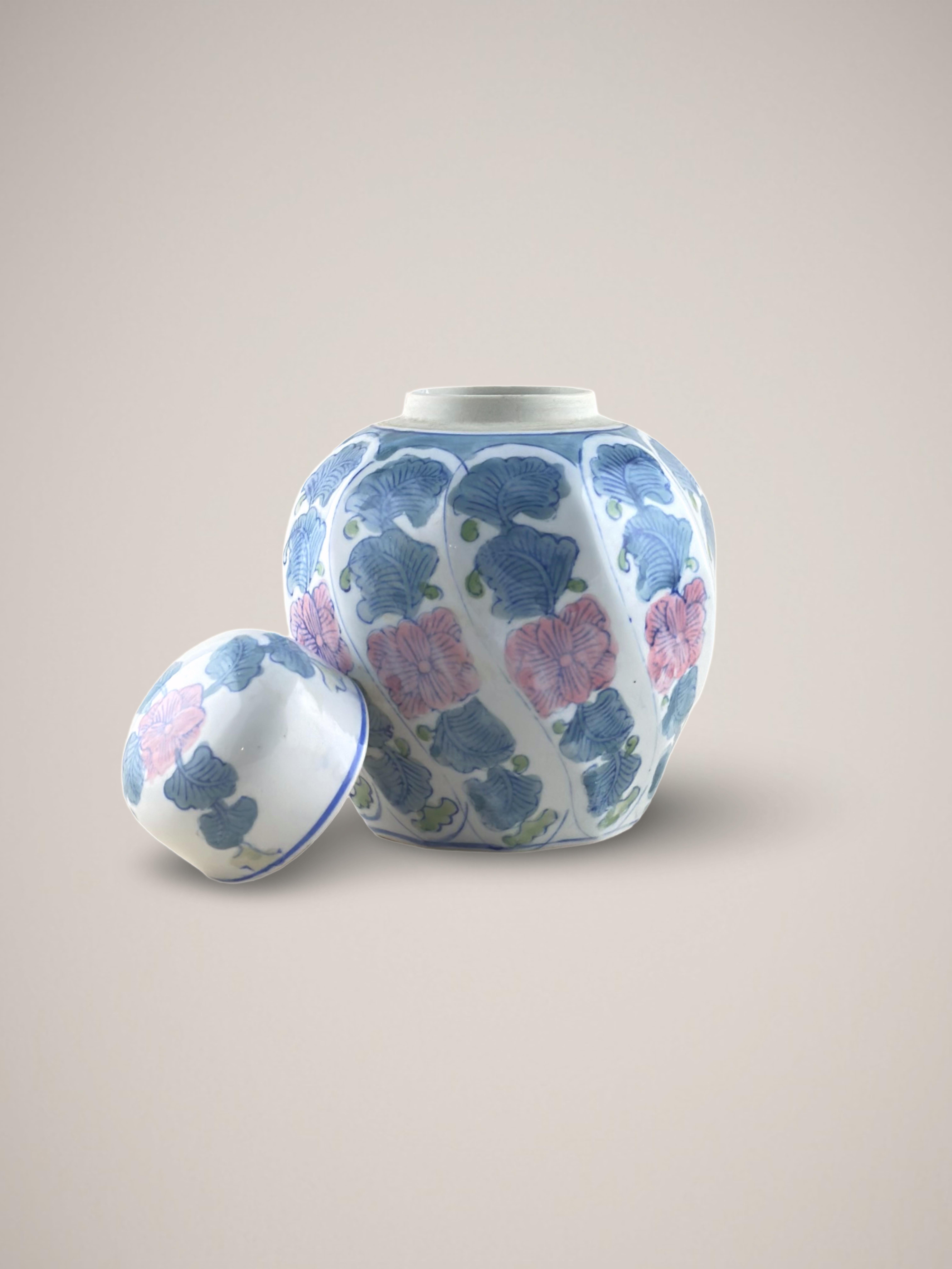  A vintage doucai ginger jar, handcrafted in China during the 1980s.

Shaped in a unique decagonal form, it features ten individual panels that smoothly twist upwards, creating a harmonious spiral shape. The doucai technique, which involves painting
