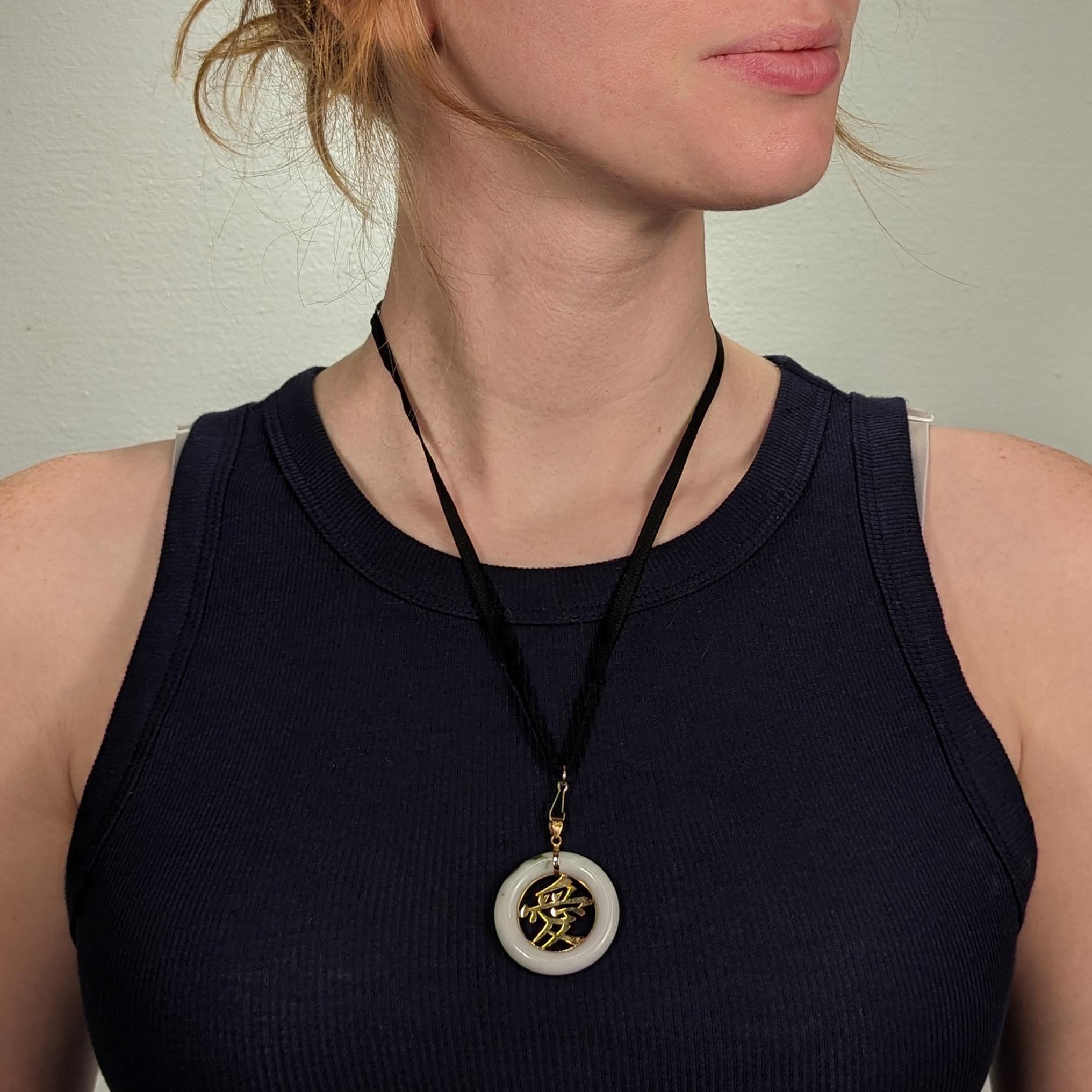 A fine vintage Chinese gold & jade pendant.

In 14k yellow gold and white jade (nephrite).

From 