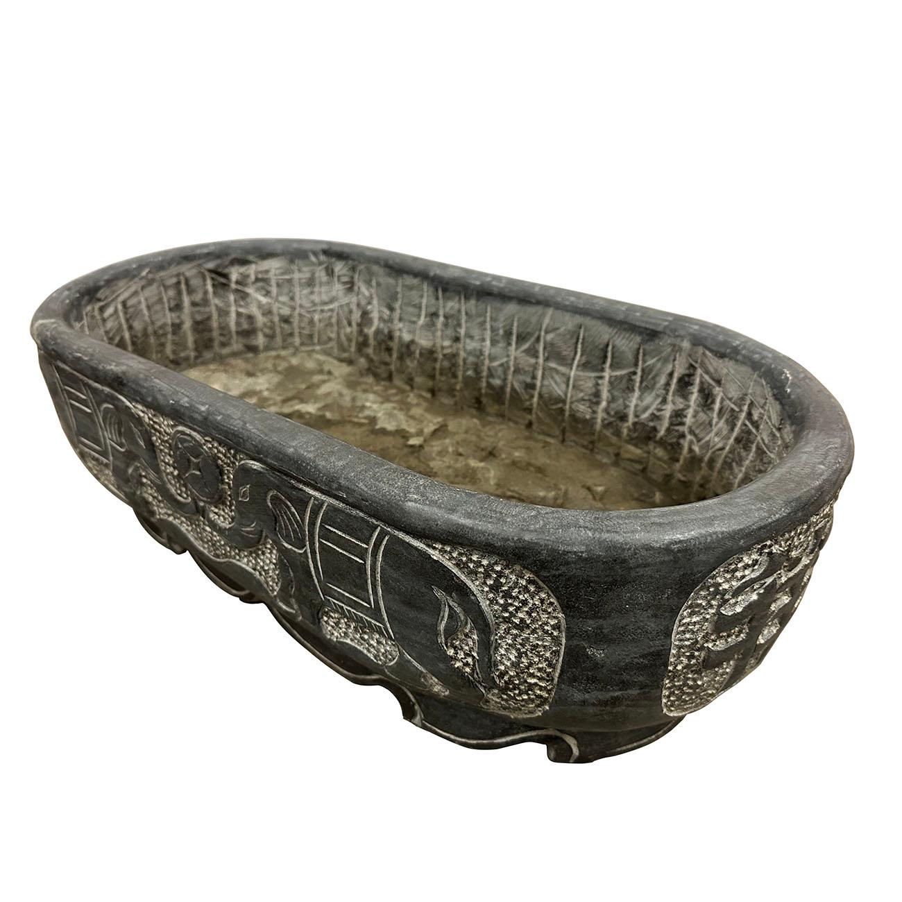 This stone planter is retrieved from the village in northern part of China. It is hand chiseled out of one piece of stone and hand carved by the local stone master. It's originally for feeding chicken, ducks, etc. Now It can be an unique garden
