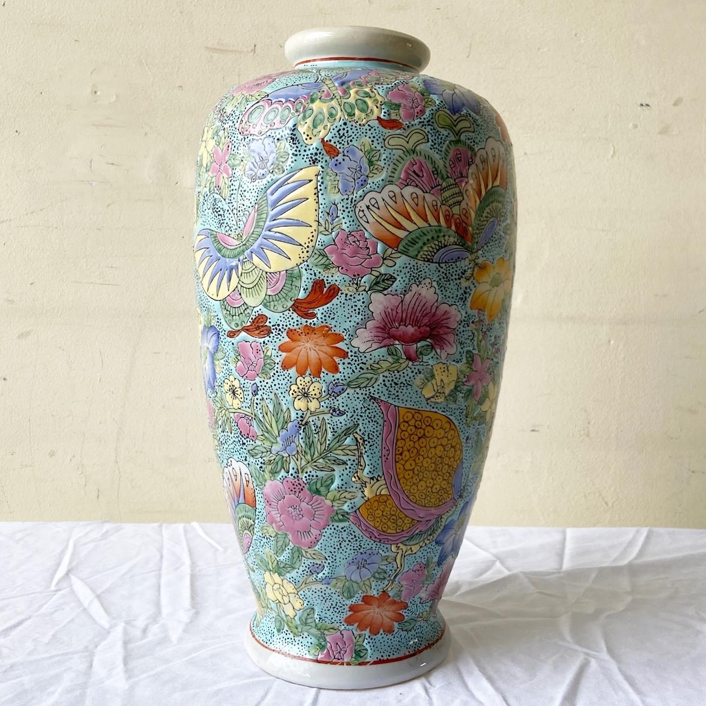 Amazing vintage Chinese hand painted vase. Features a multi colored finish with etched butterflies and flowers.
