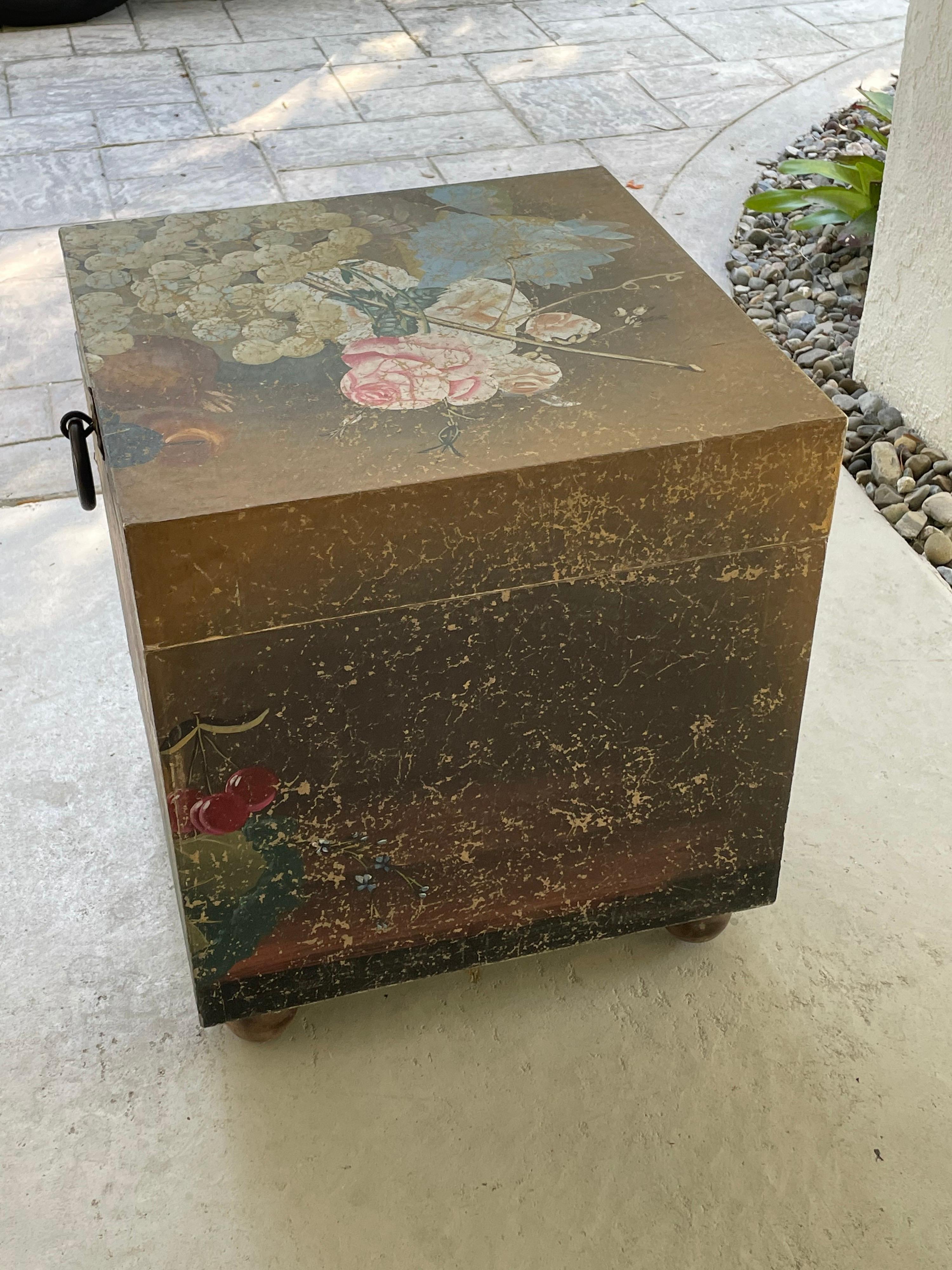 This is a 1970 hand painted Chinese wood trunk with metal circle handle 
The trunk is of painted flowers and fruit.