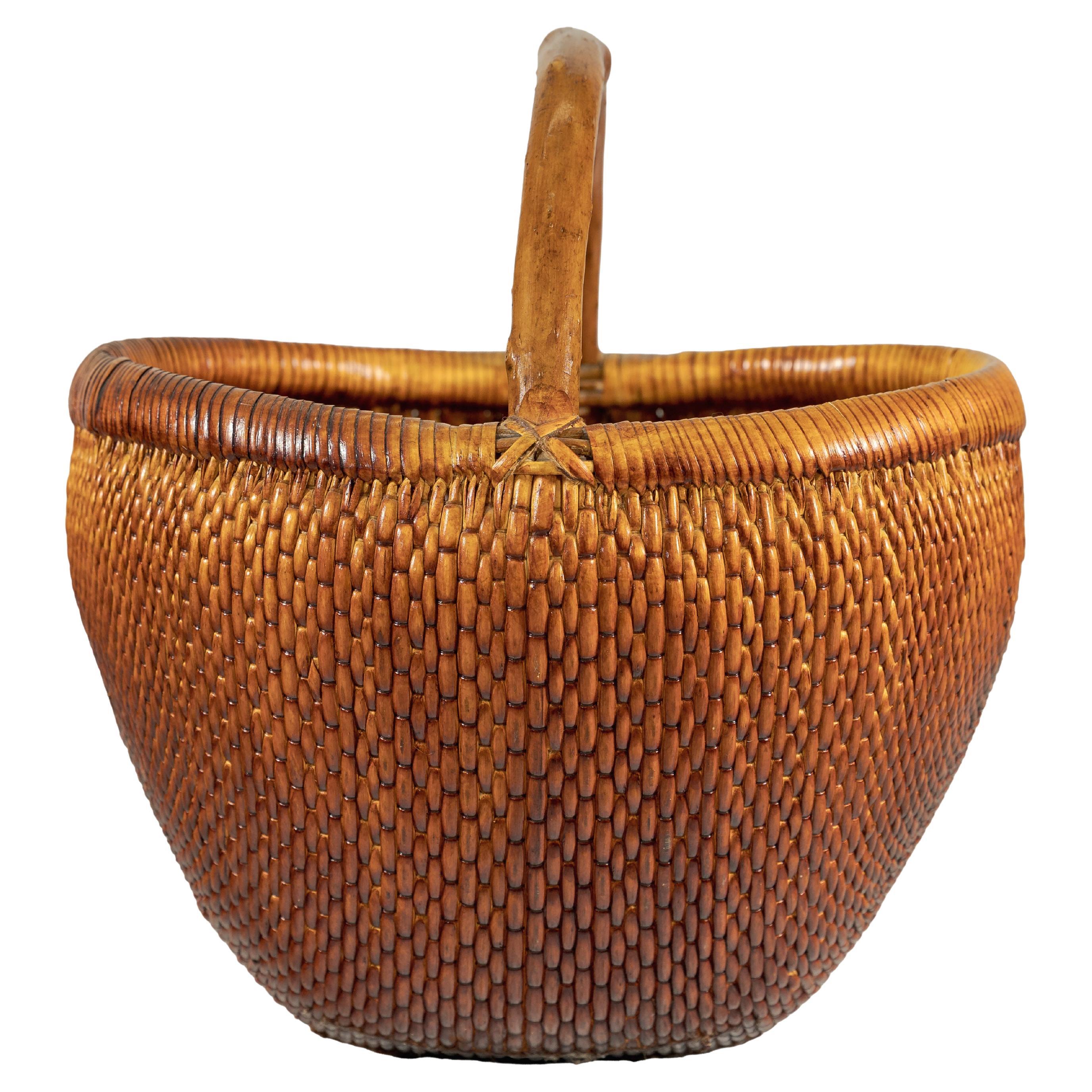 Vintage Chinese Handwoven Rattan Carrying Basket with Arched Handle