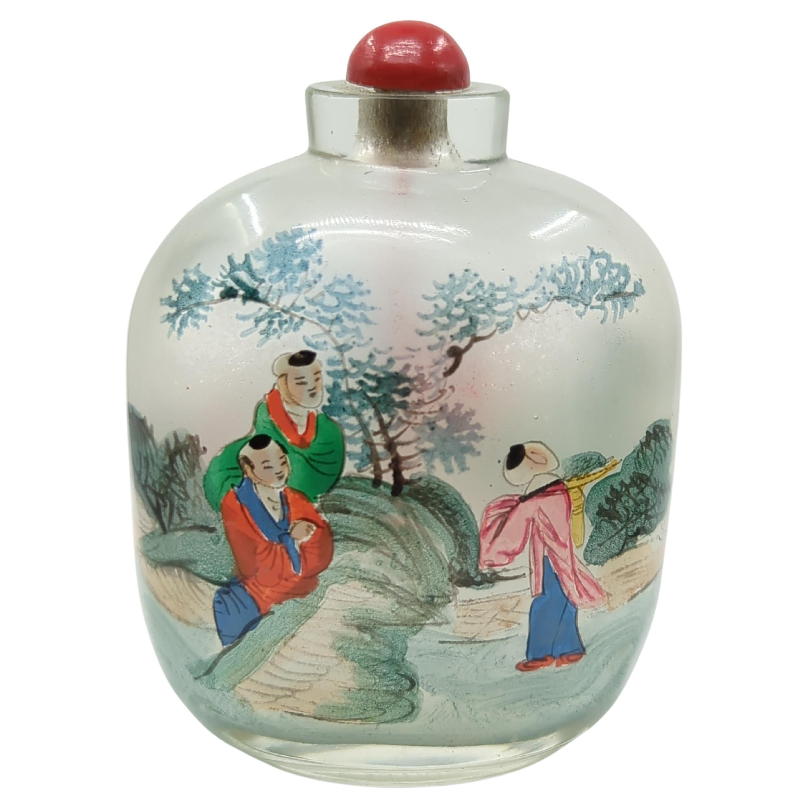 An antique Chinese inside painted glass snuff bottle ( IPSB ), both sides hand decorated with 3 boys in a treed courtyard scene

circa: 1900, Late Qing, Late 19th Century to Early 20th Century