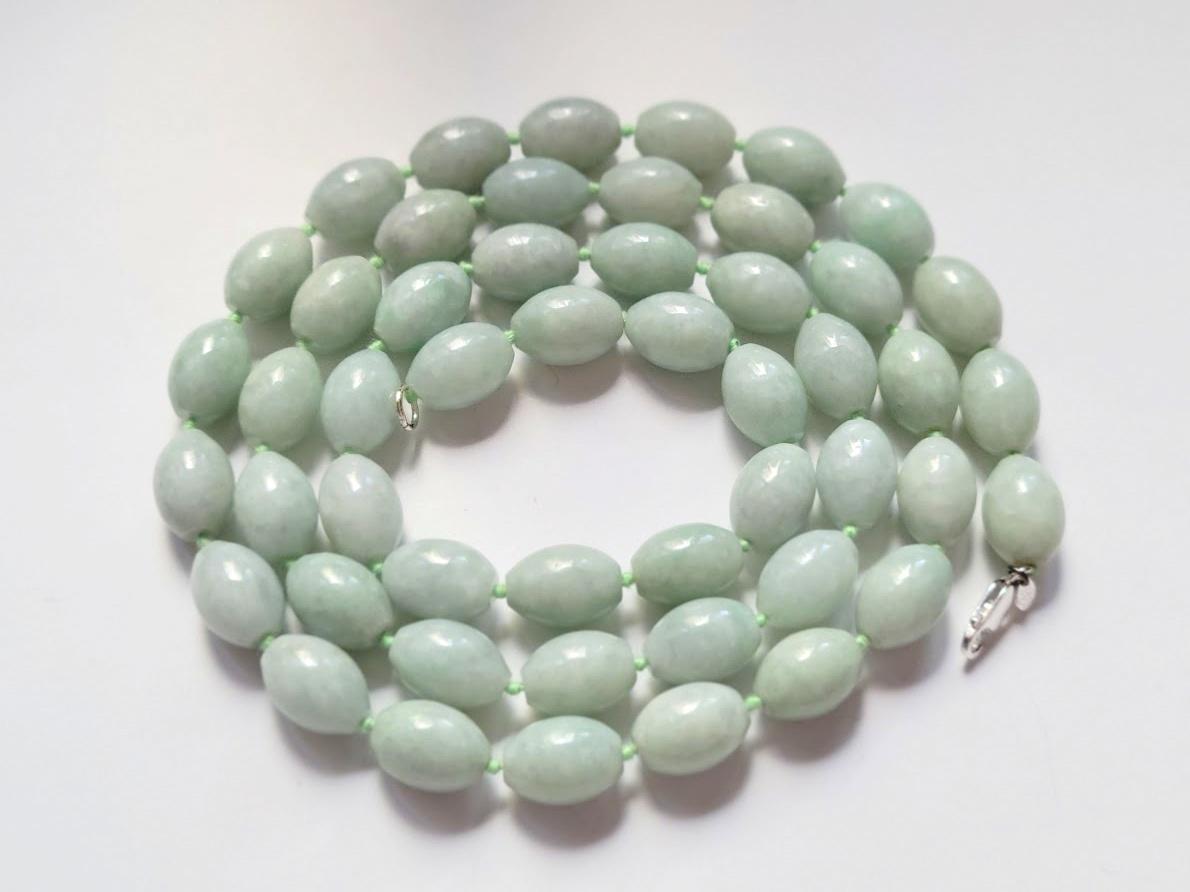 The necklace is 36.5 inches long (92 cm) and weighs 212 grams (7.5 oz).
The size of the smooth olive jade beads is 16.5 mm in diameter, and beads knotting is traditionally done with silk thread, placing a knot between each bead to prevent them from