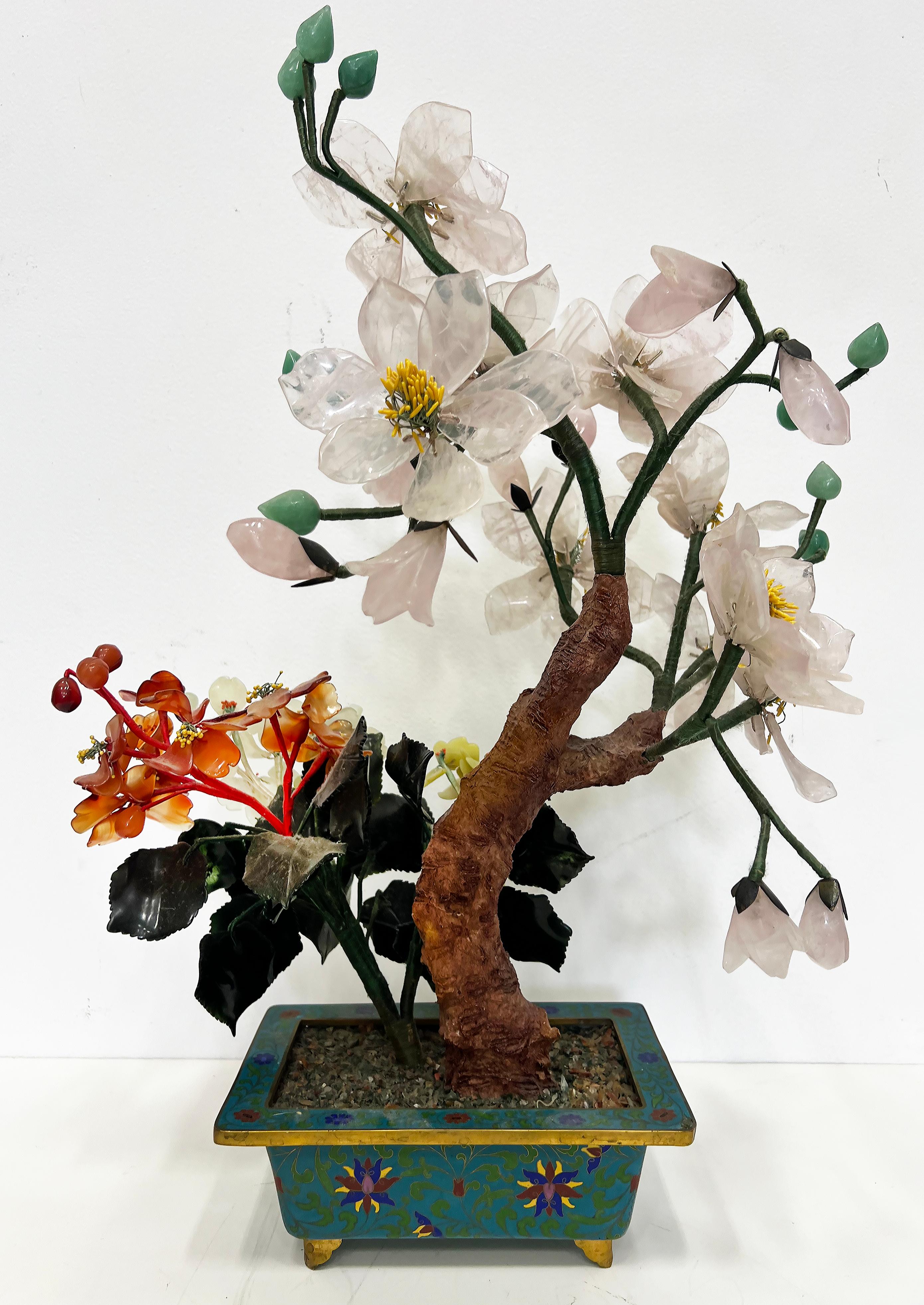 Vintage Chinese Jade Precious Stone Bonsai Tree Sculpture, Cloisonné Planter

Offered for sale is a vintage Chinese Jade and other semi-precious stones Bonsai tree in a gilt planter.  The tree is dense and artistically created with many different