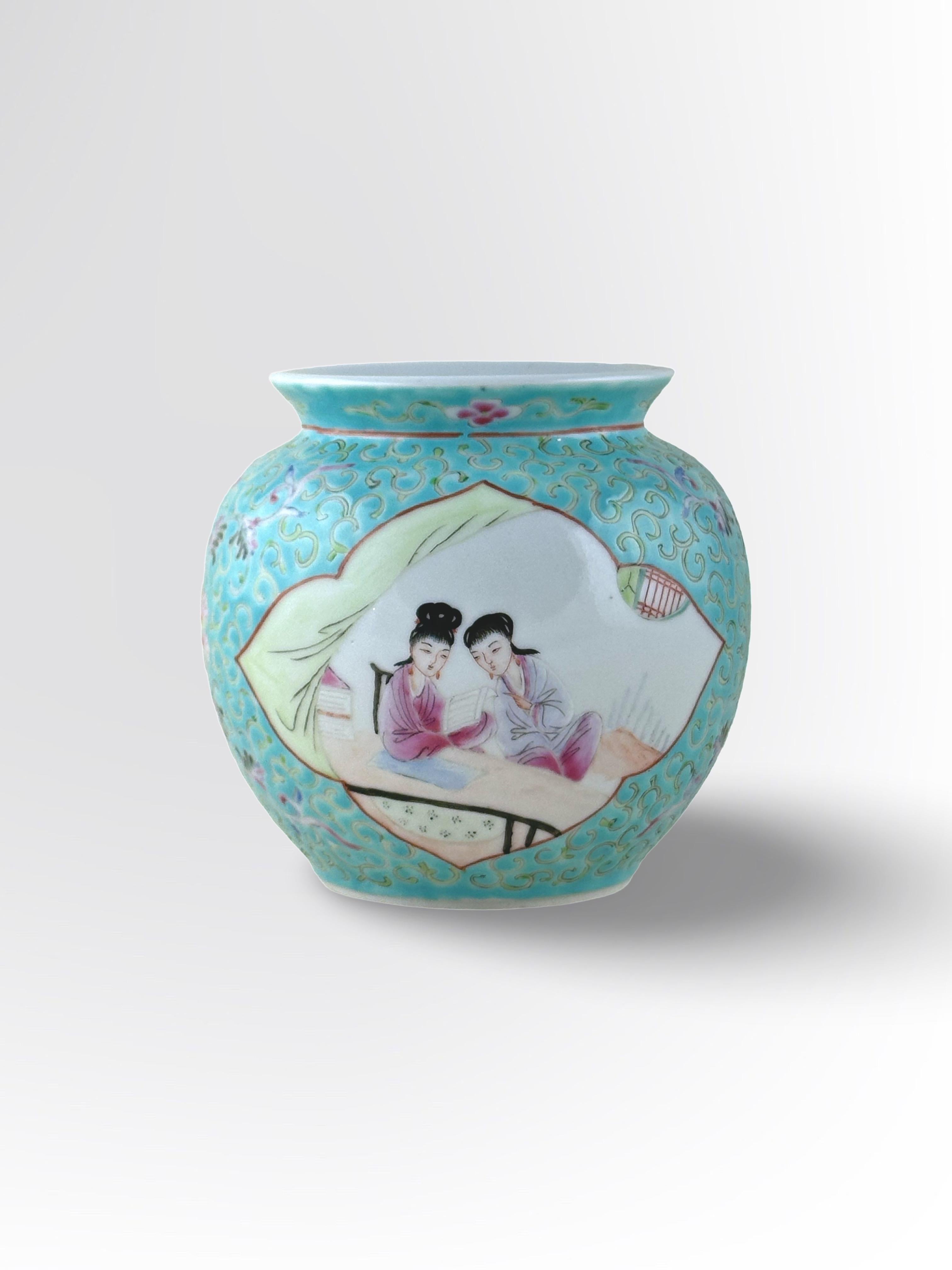 A vintage Chinese porcelain jar, signed on its underside with 'Jiangxi Chu Pin'. 

The jar is adorned with a colourful 'Famille Rose' style decoration of two figural scenes, each depicting a mother/female and child. The first scene shows a mother