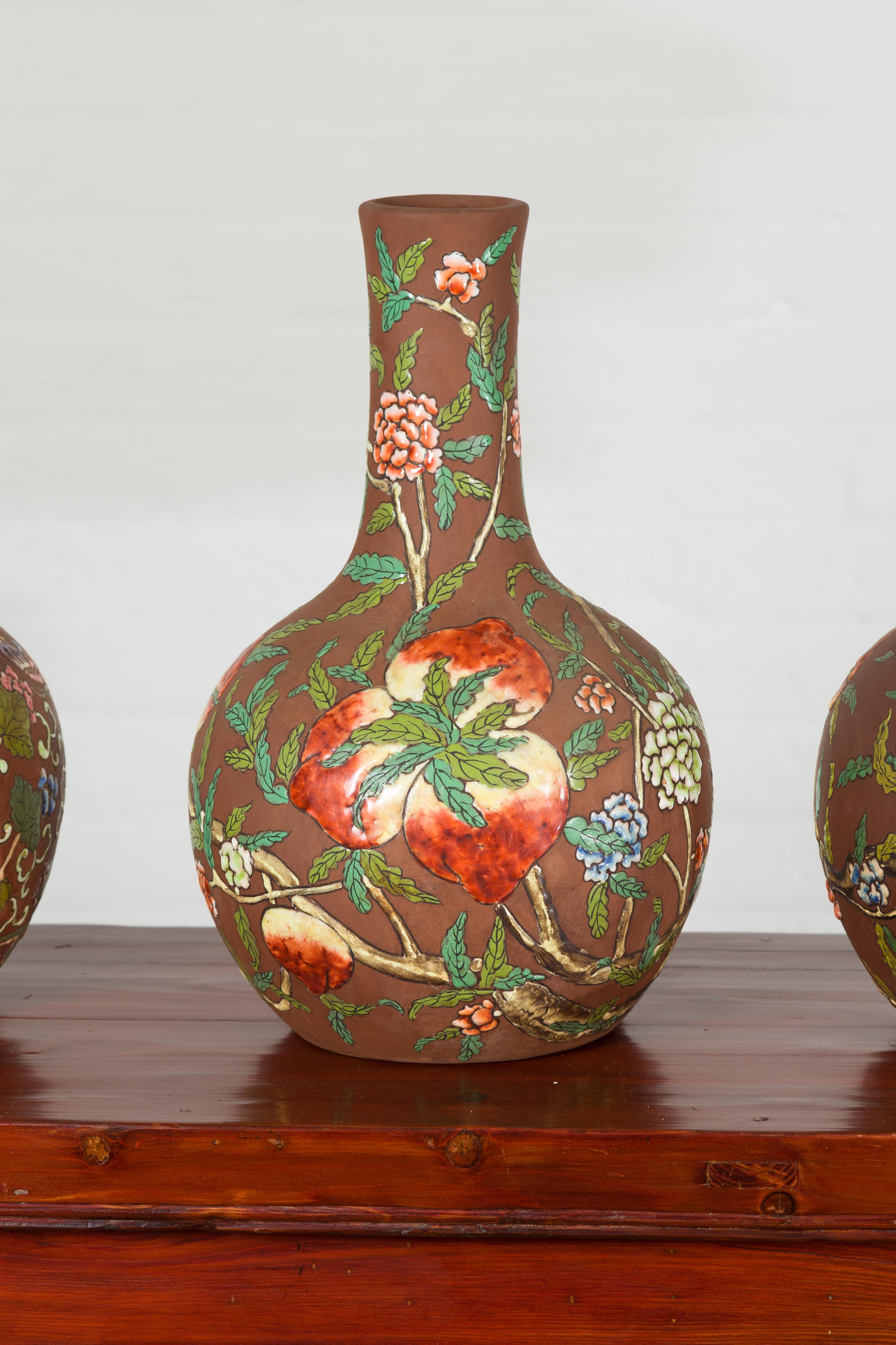 Ceramic Vintage Chinese Kendi Shape Porcelain Vases with Raised Floral and Fruit Décor For Sale