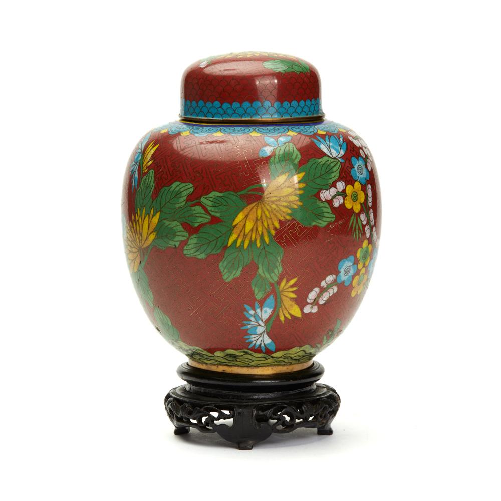 A fine vintage/antique Chinese cloisonné lidded ginger jar and associated wooden display Stand. The jar is decorated with fine brass wire work with floral designs on a red ground with patterned turquoise and yellow banding around the edges. The