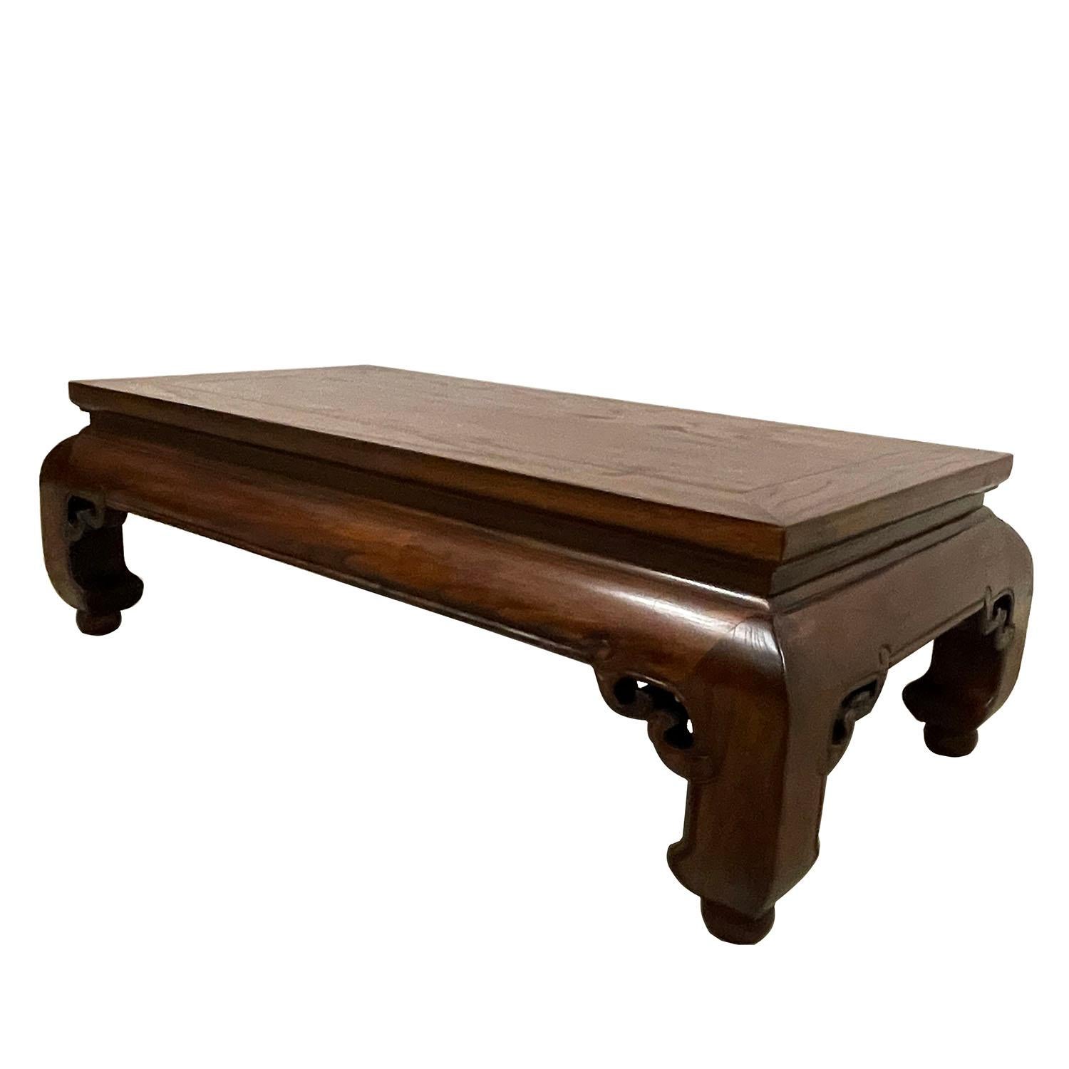 This vintage Chinese carved Ming Dynasty style coffee table is made of solid Elm wood with natural finished. It has narrow carved waist and four big banana legs which is typical Ming dynasty style. Very smooth to touch and full of patina. You can
