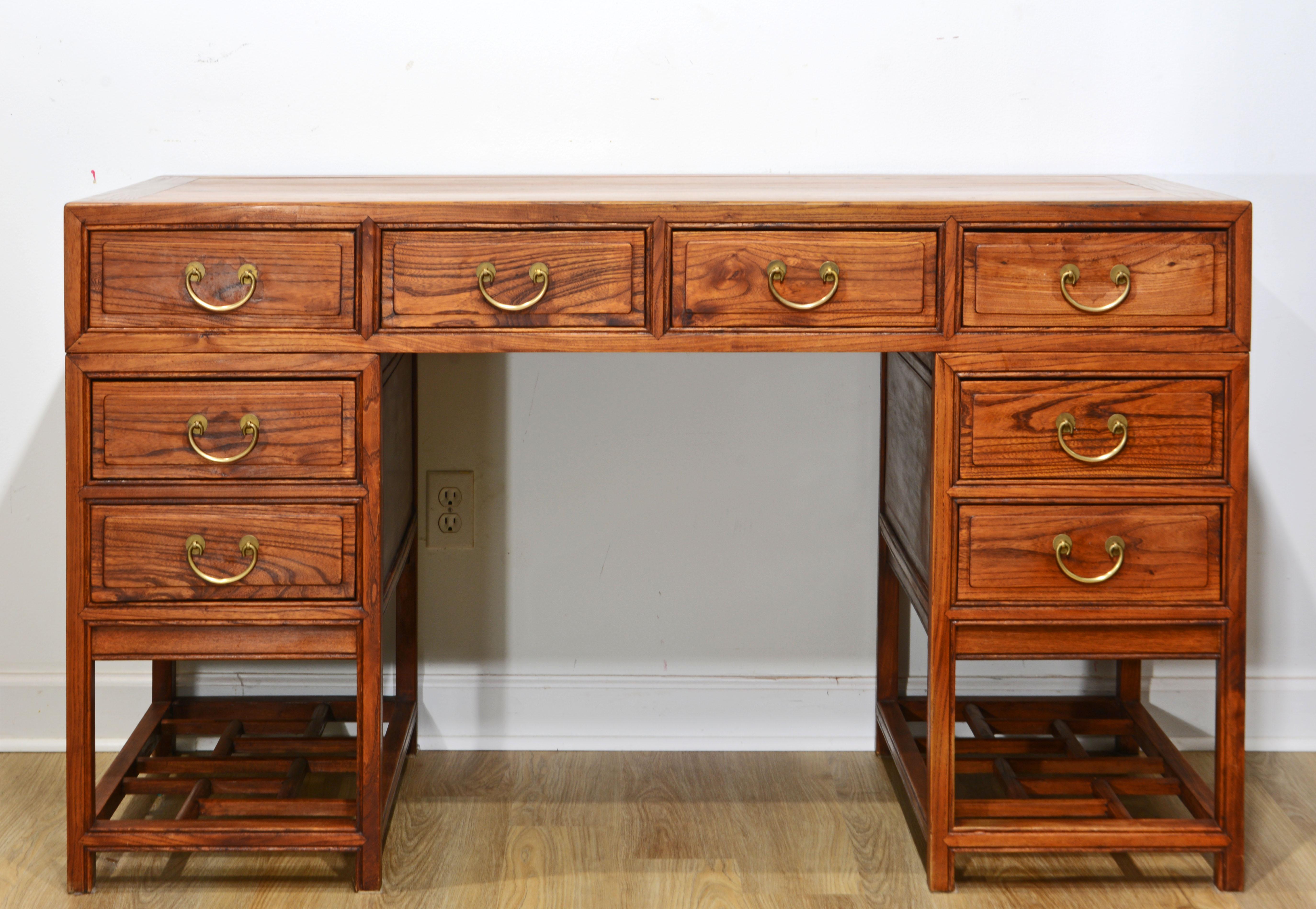 Originally treated with linseed oil this Chinese Ming style scholar's desk retains the warm color and beautiful grain. The top is plank framed on all sides adding a look of quality craftsmanship. The desk is in three parts making it easy to move.