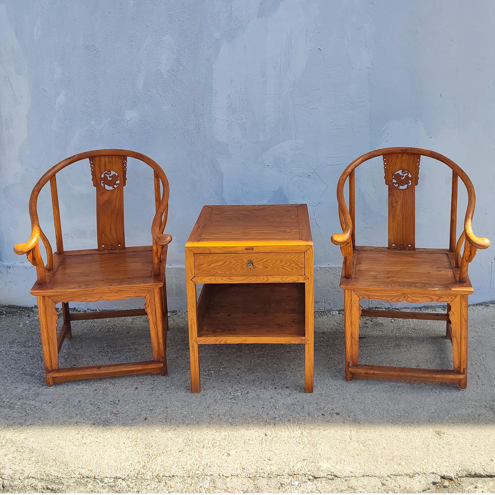 Vintage Chinese Ming Style Natural Wood Horseshoe Pair of Armchairs and Table.
Dimensions: 
Armchairs 68x68x107cm
Table 60x60x74cm
Good overall condition, normal wear according to their age.

A pair of wood horseshoe back armchairs from the
