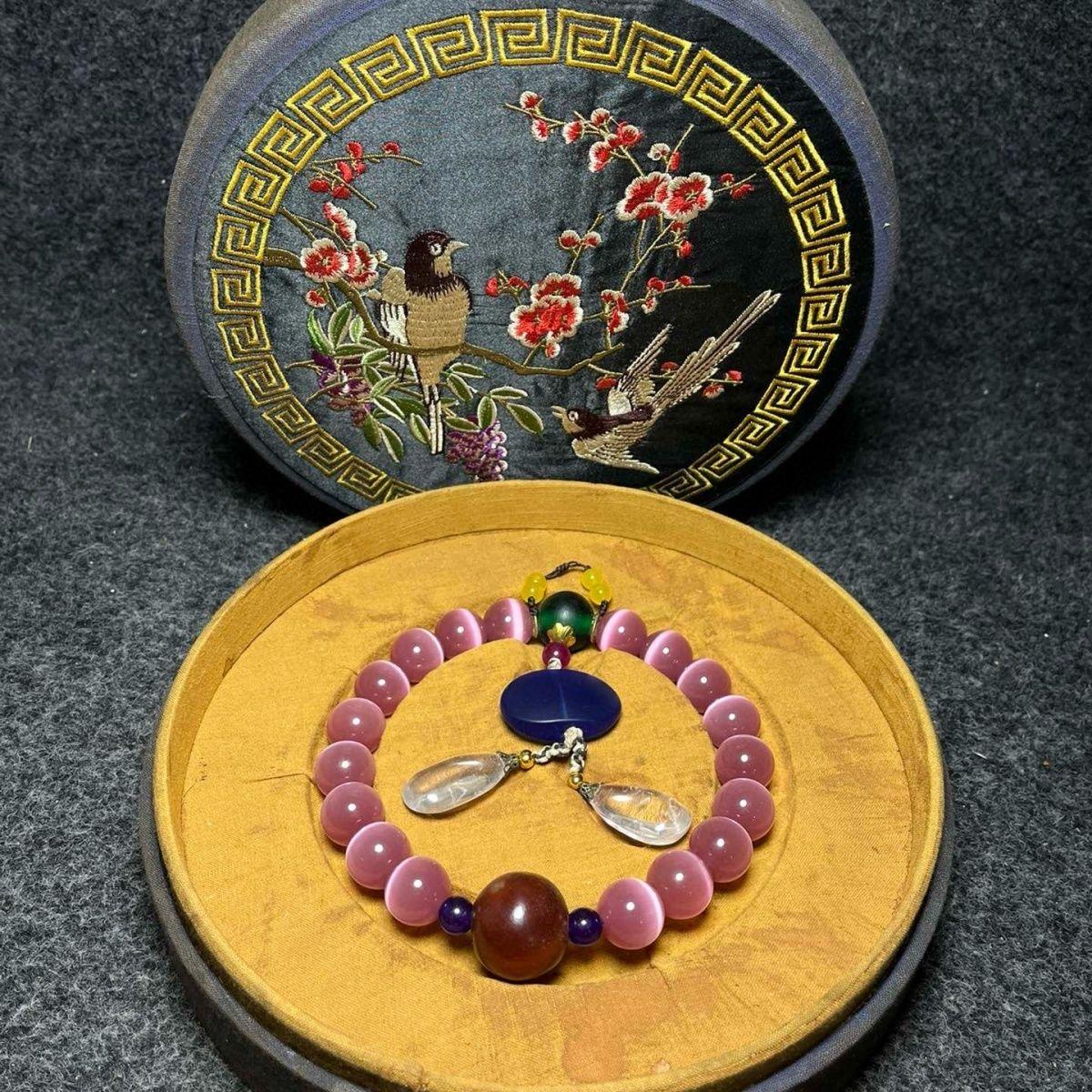 This elegant Vintage Chinese Bracelet features eighteen luminous opal beads, carefully strung to symbolize blessings, protection, and spiritual balance. Each opal bead shimmers with subtle hues, reflecting the beauty and mystique associated with