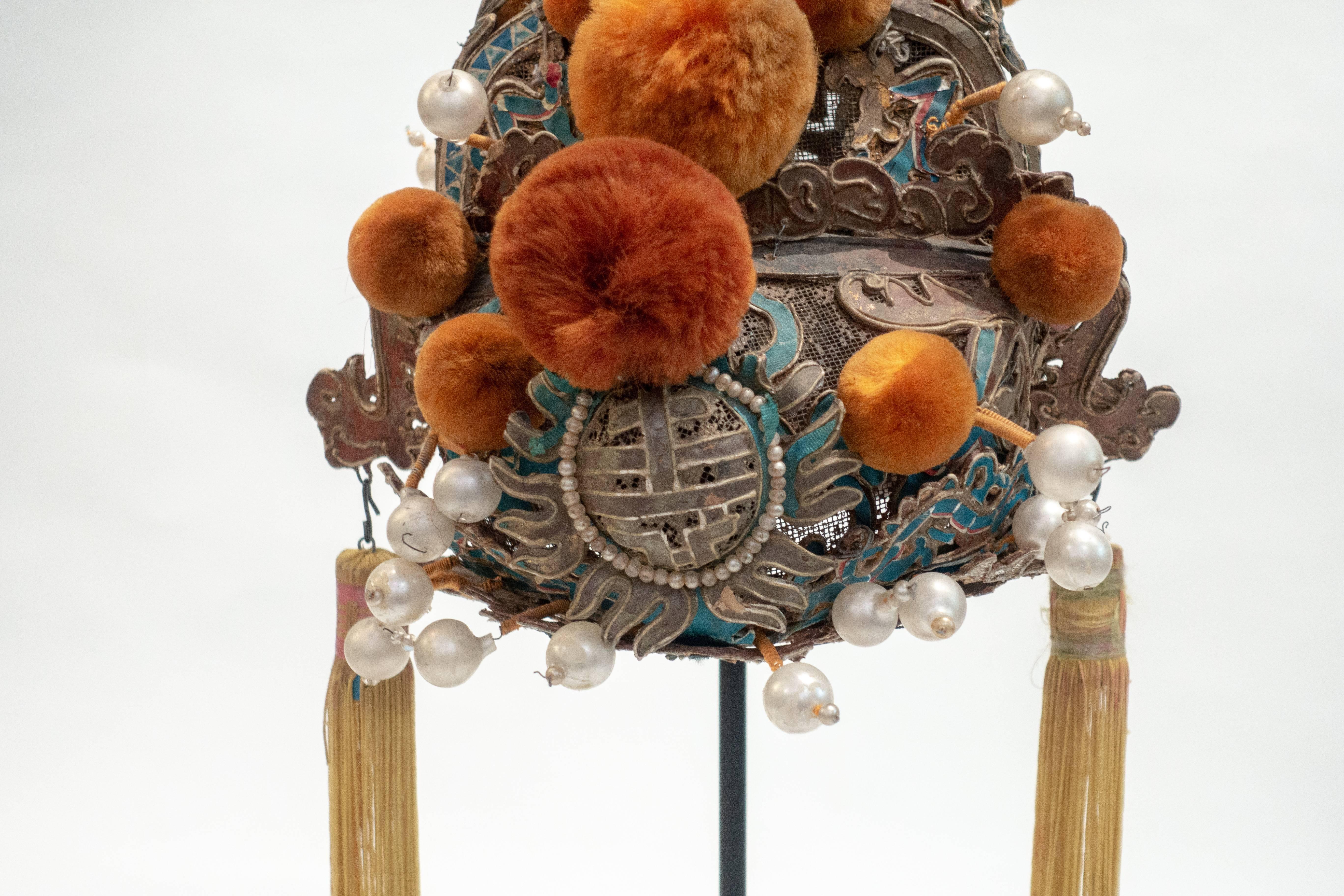 Vintage Chinese opera theatre headdress, early 20th century, mounted on a custom, black painted metal base.