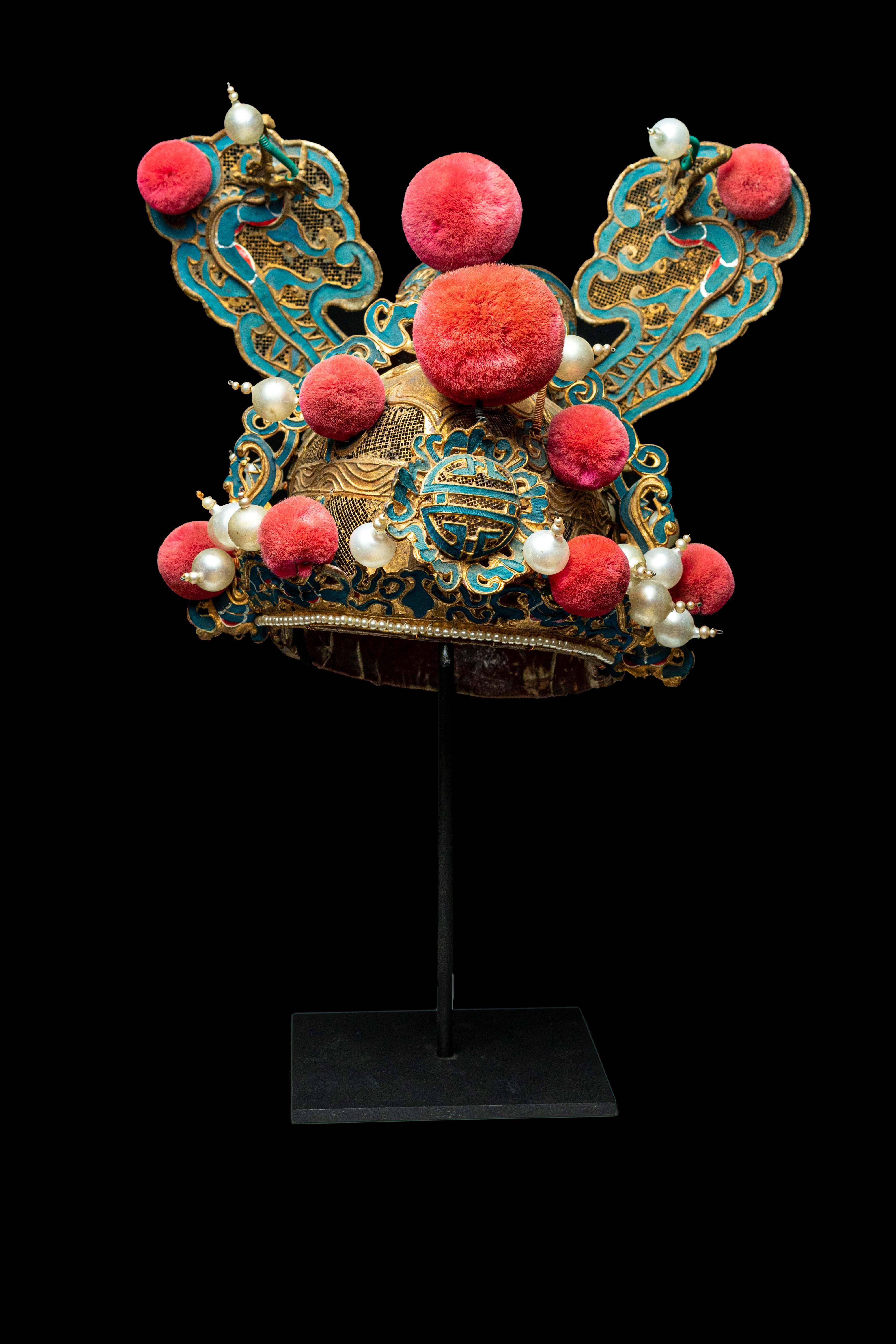 Vintage Chinese opera theatre headdress, early 20th century, mounted on a custom, black painted metal base.