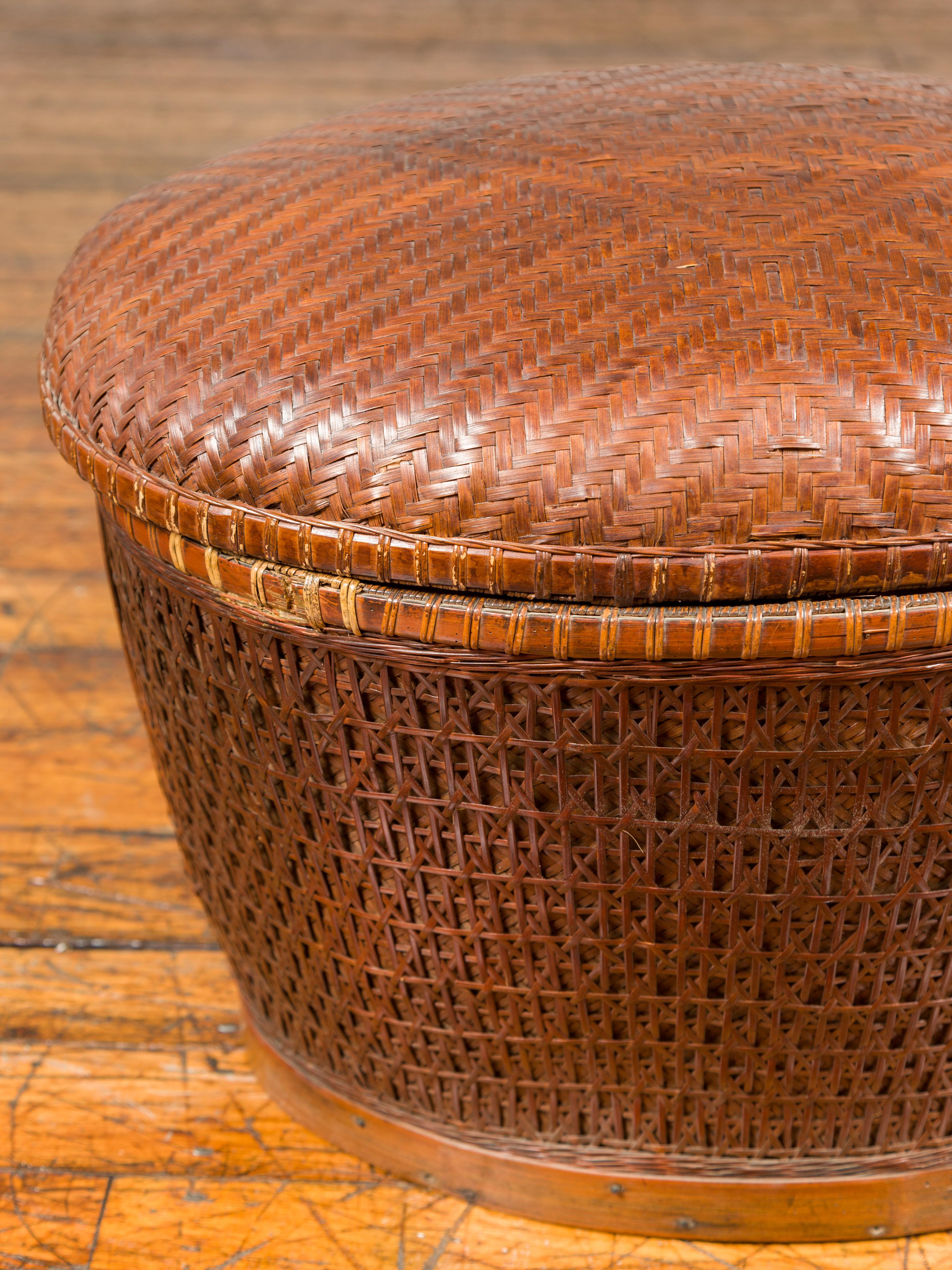 20th Century Vintage Chinese Oval Woven Rattan Basket with Lid and Geometric Motifs For Sale