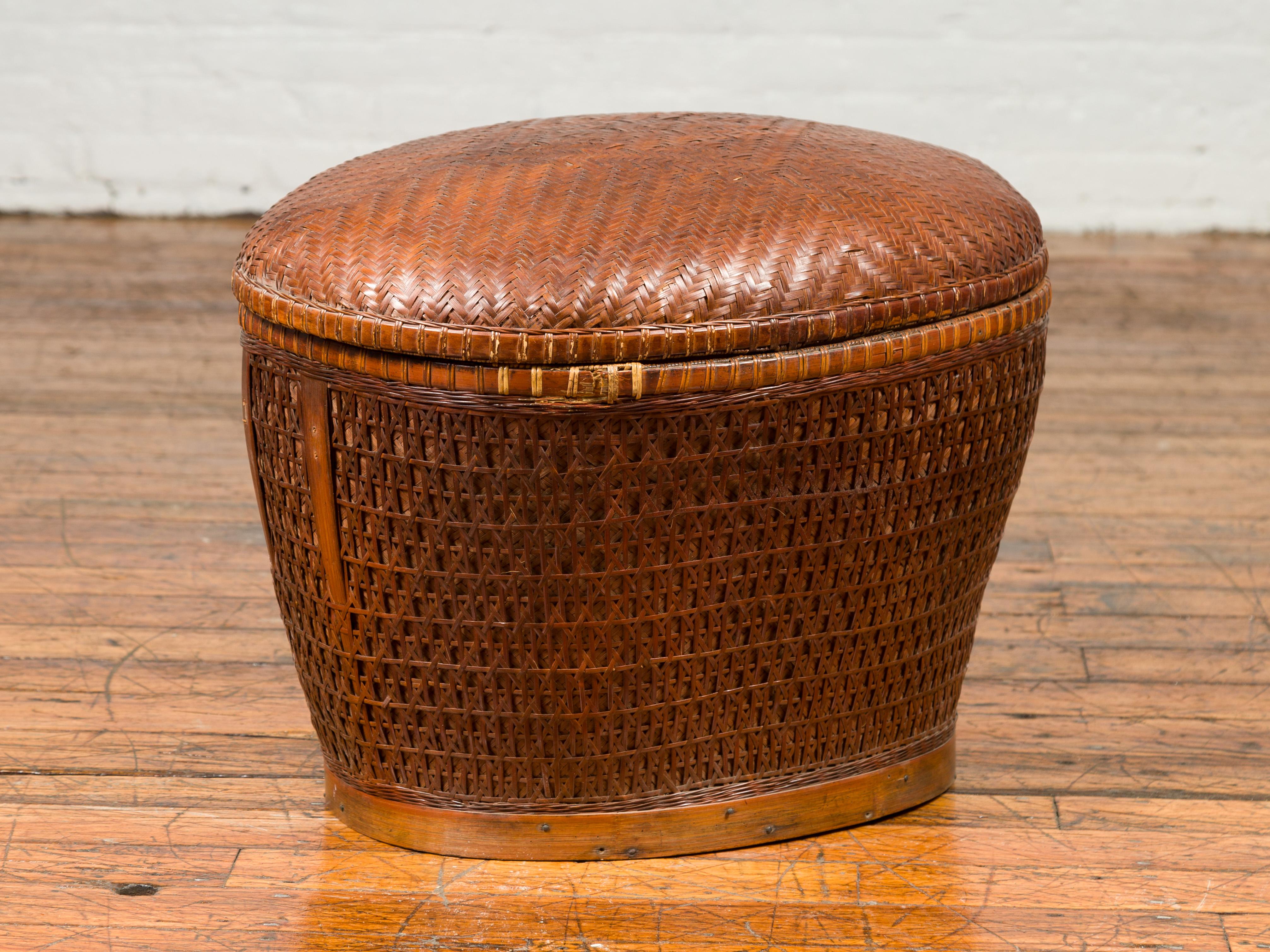 Vintage Oval Woven Rattan Basket with Lid and Geometric Motifs In Good Condition For Sale In Yonkers, NY