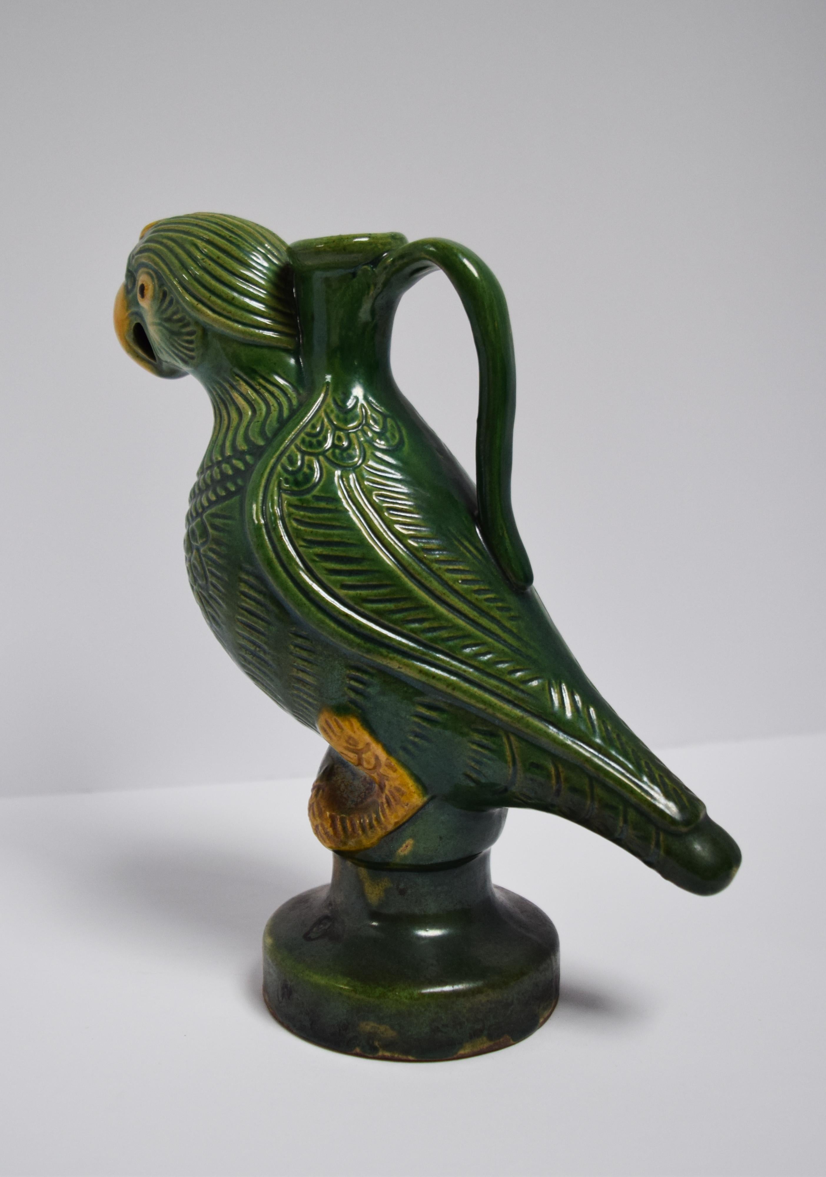 For centuries, the figure of the parrot has a rich history of symbolic meaning in China. In the later part of the 19th century, ceramic birds adorned public buildings and the homes of prominent figures. This beautiful hand-painted candle holder is